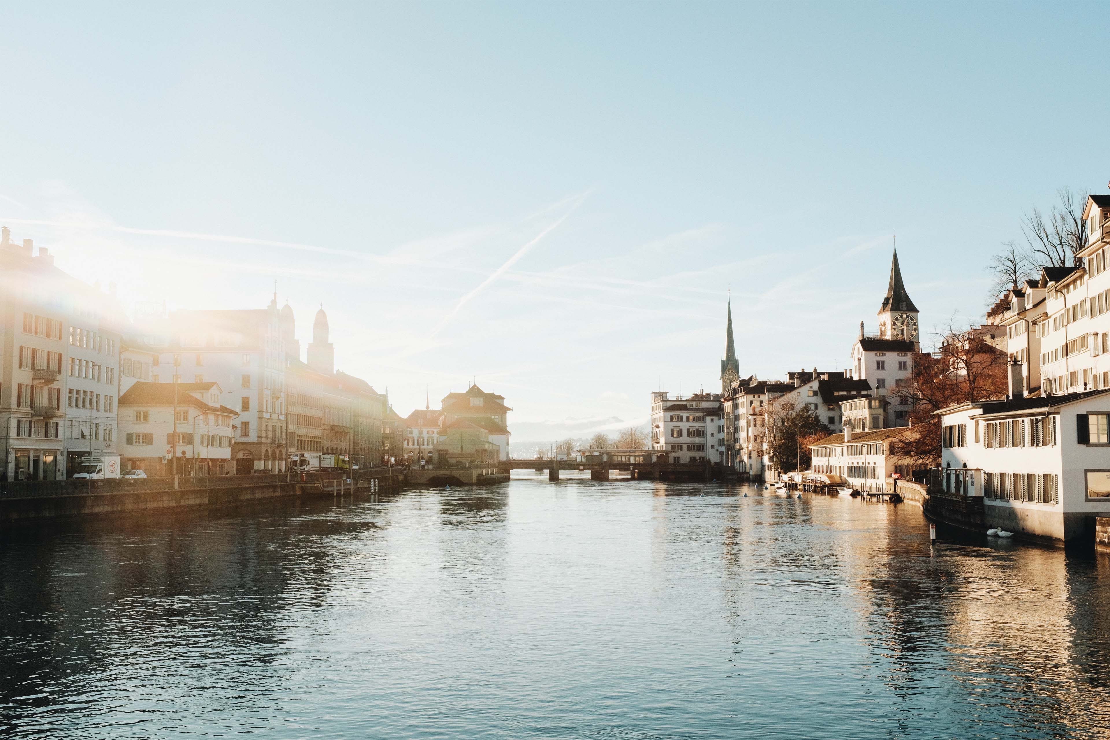 buildings with blue sky and river