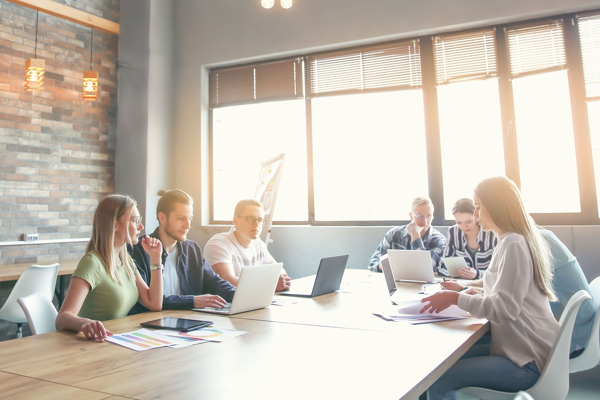 Young people having business meeting in modern office