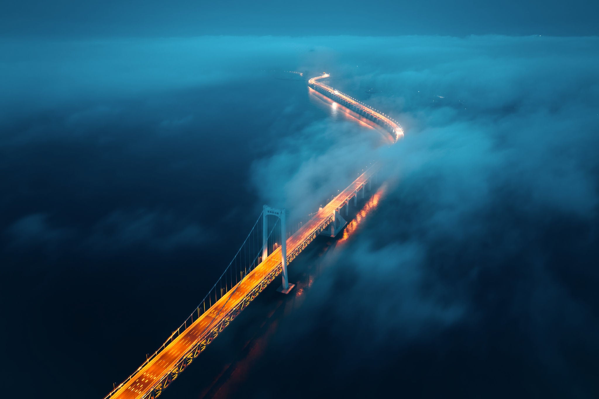 bridge over a river in the dark
