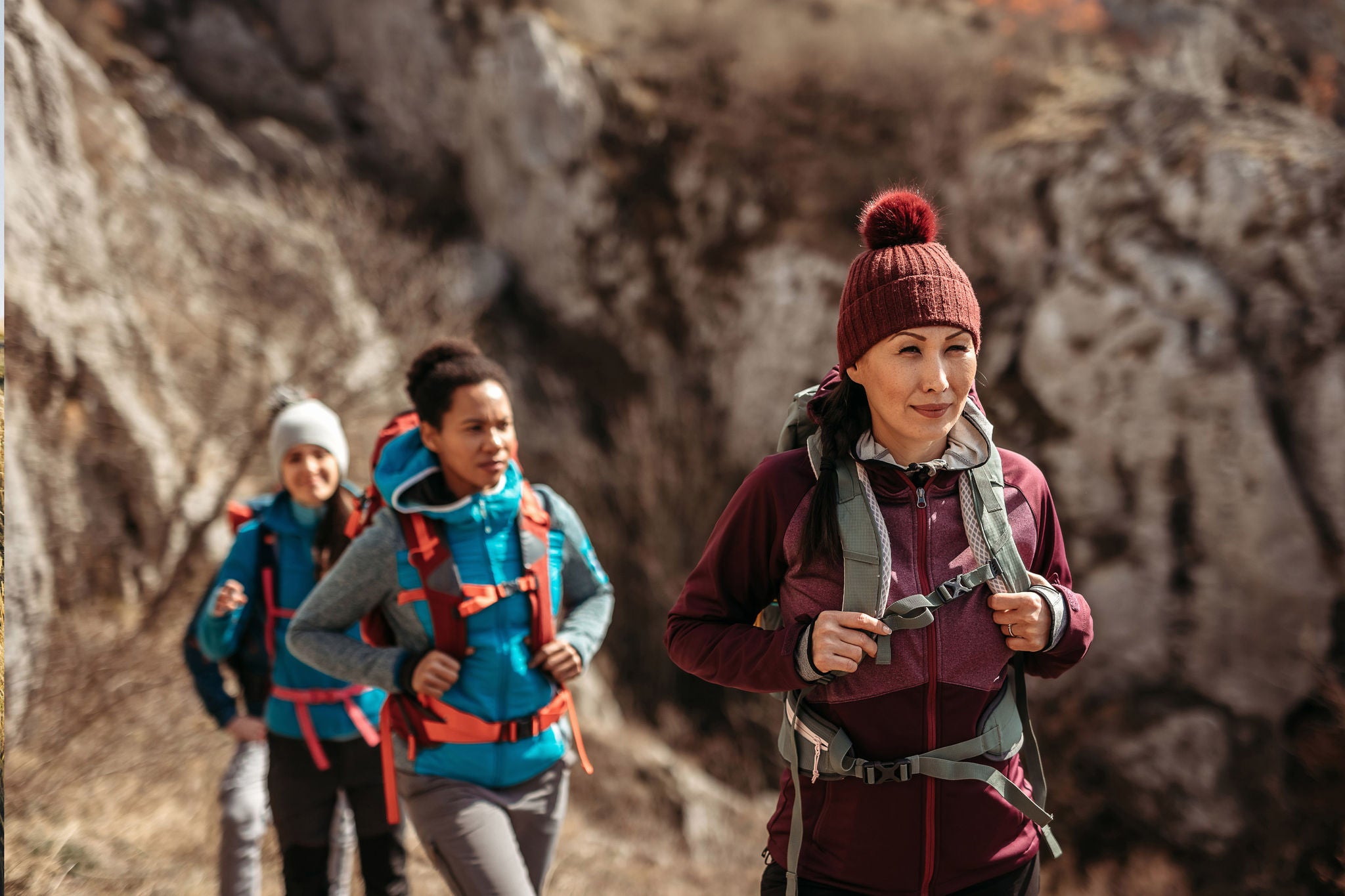 Group of tourist on hiking tour walking in nature
