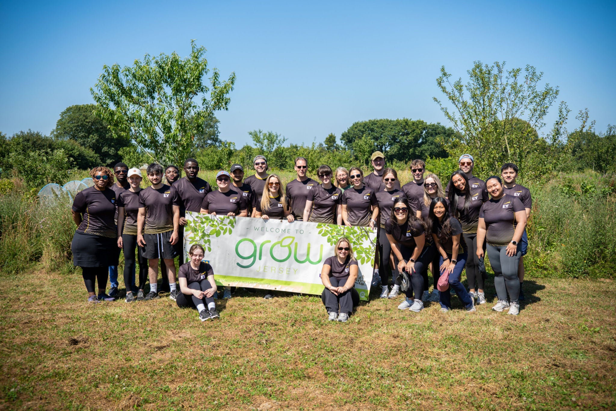 Photograph of EY volunteers supporting the GROW community