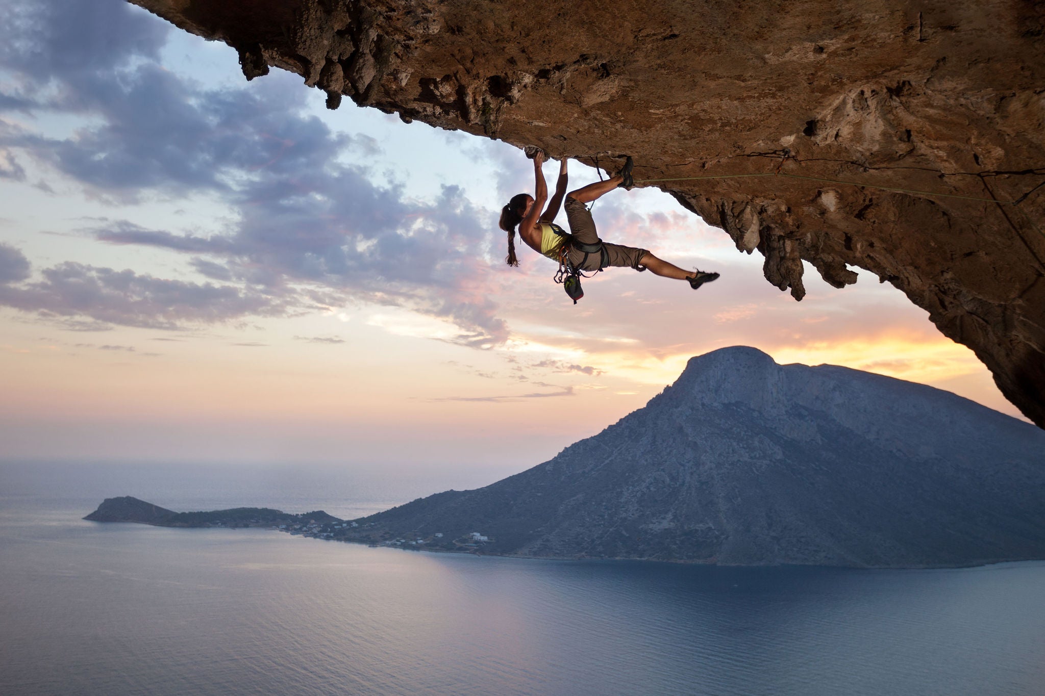 ey young female rock climber at sunset kalymnos island greece