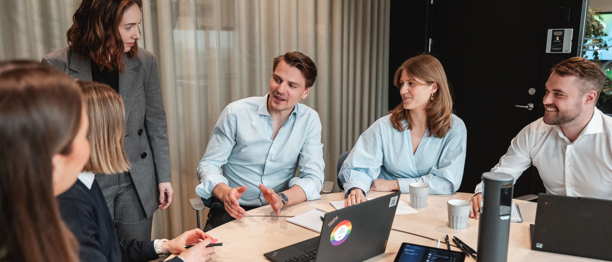 Team discussing ideas together during a collaborative office meeting