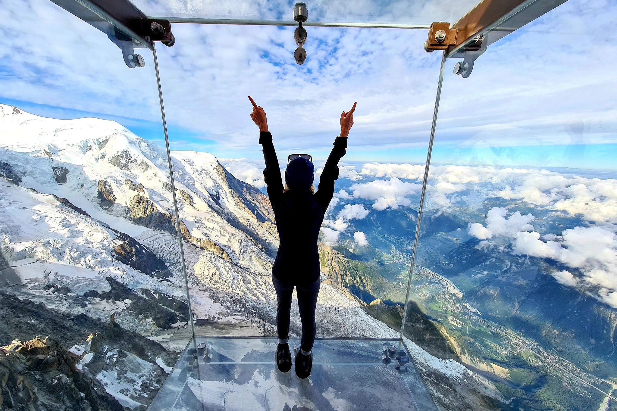 Woman admiring the view from the Aiguille du Midi Skywalk