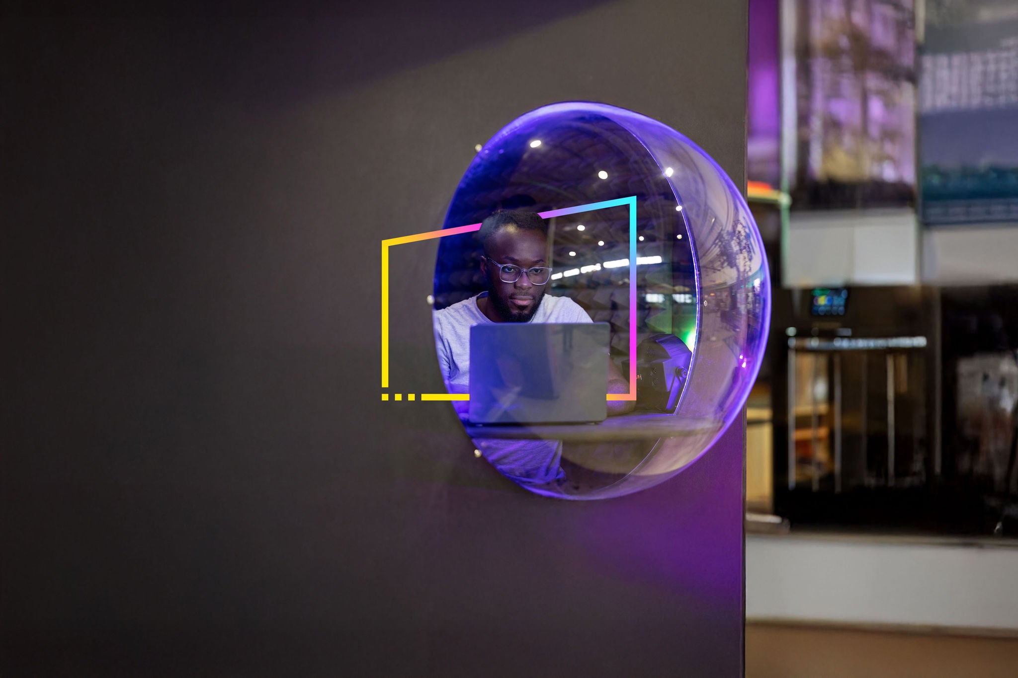 Joyful friends watching movies on a projection screen  in the backyard