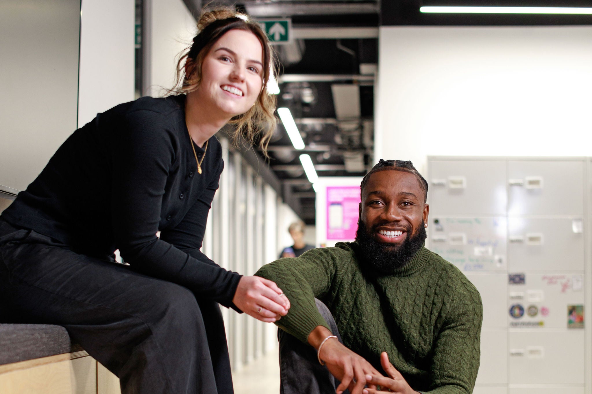 Two colleagues sitting and laughing