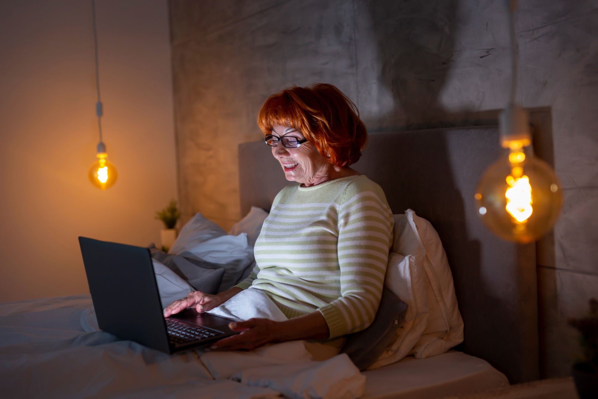 EY Senior woman having video call on laptop