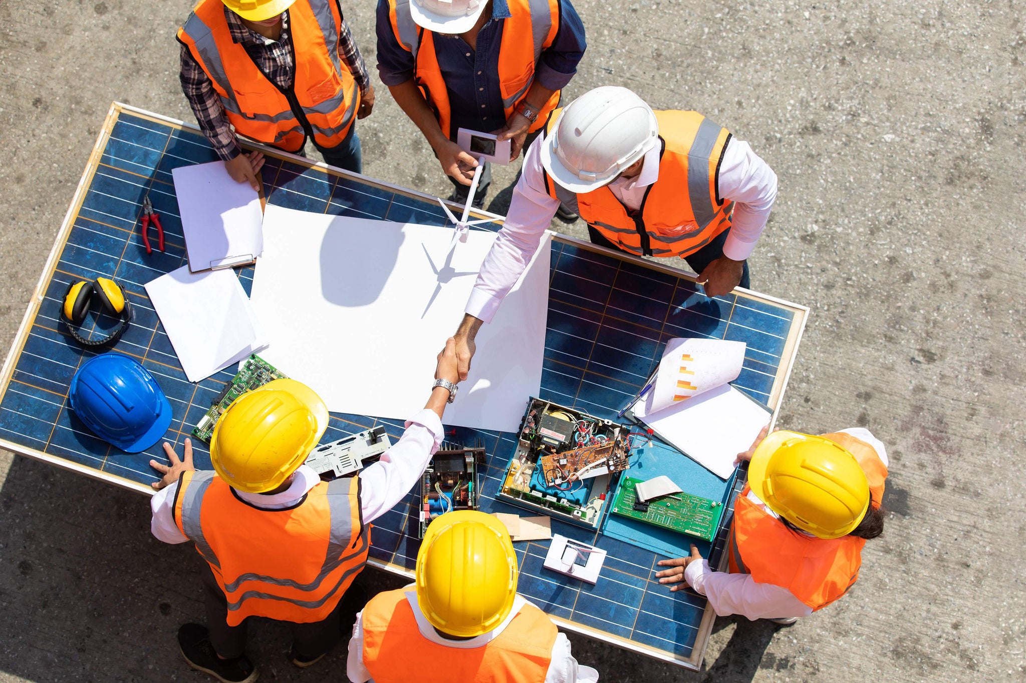 man helping women to cross the stone