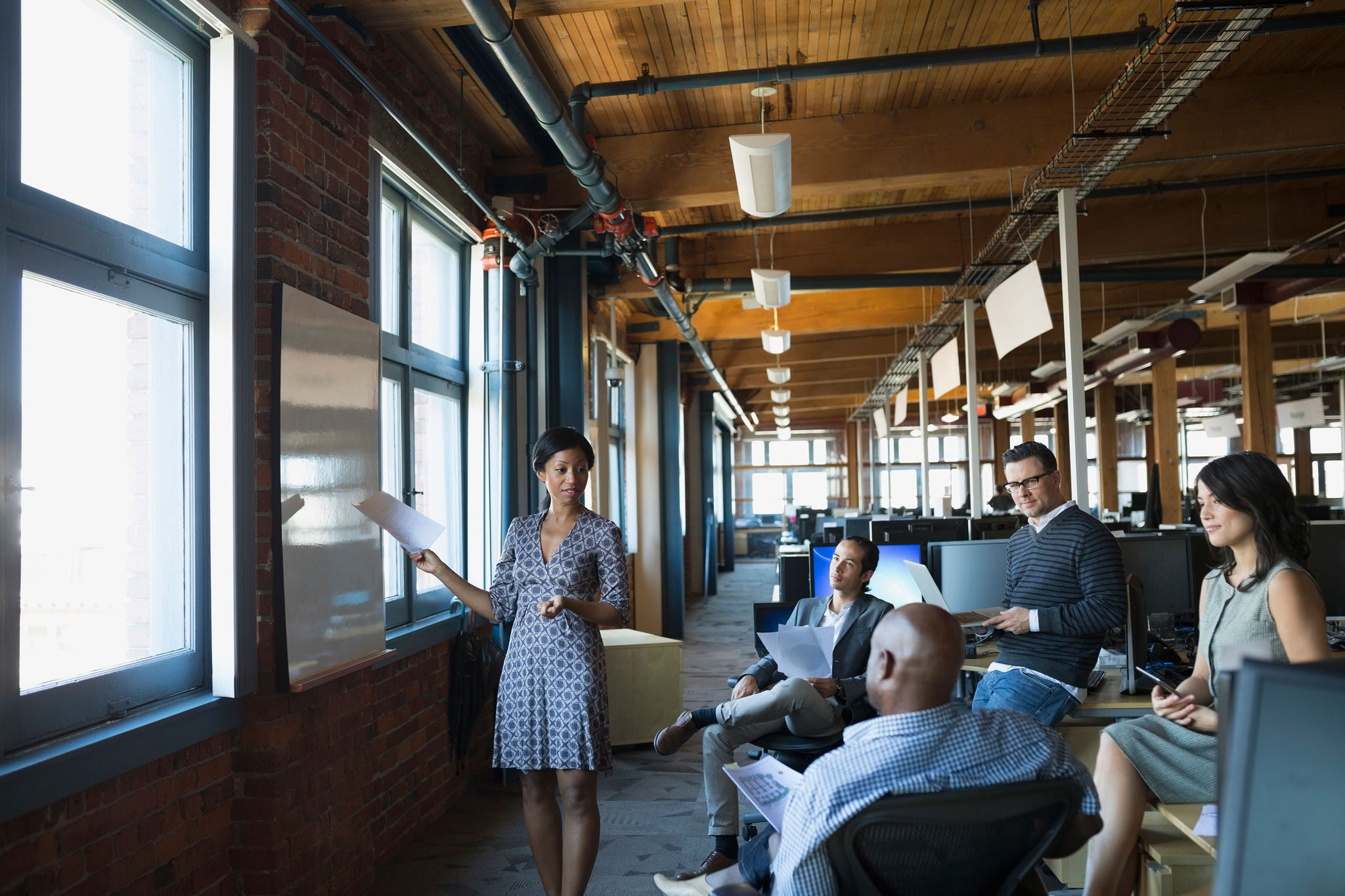 Business people meeting at whiteboard in office