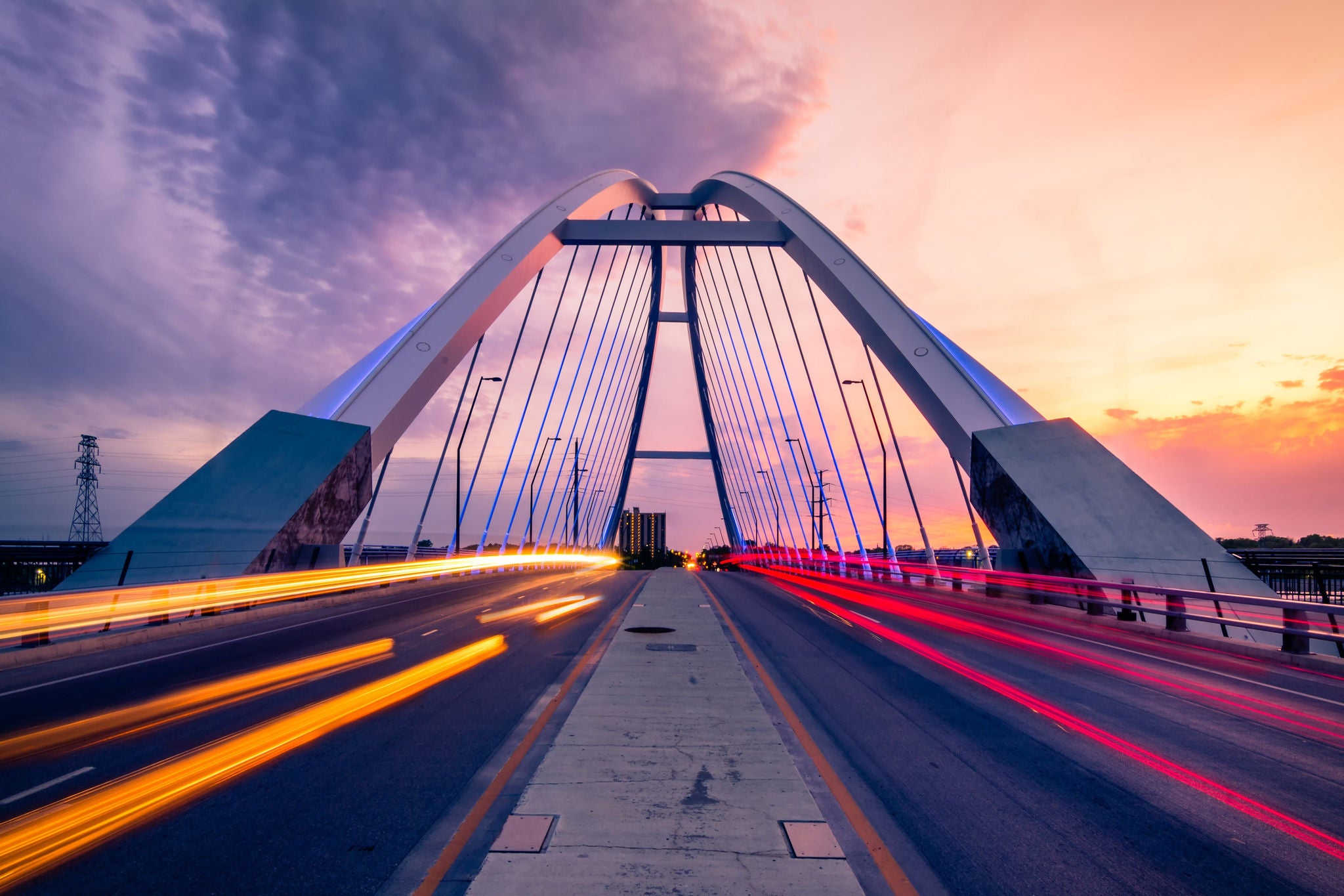 car trails at lowry bridge in minneapolis at sunset