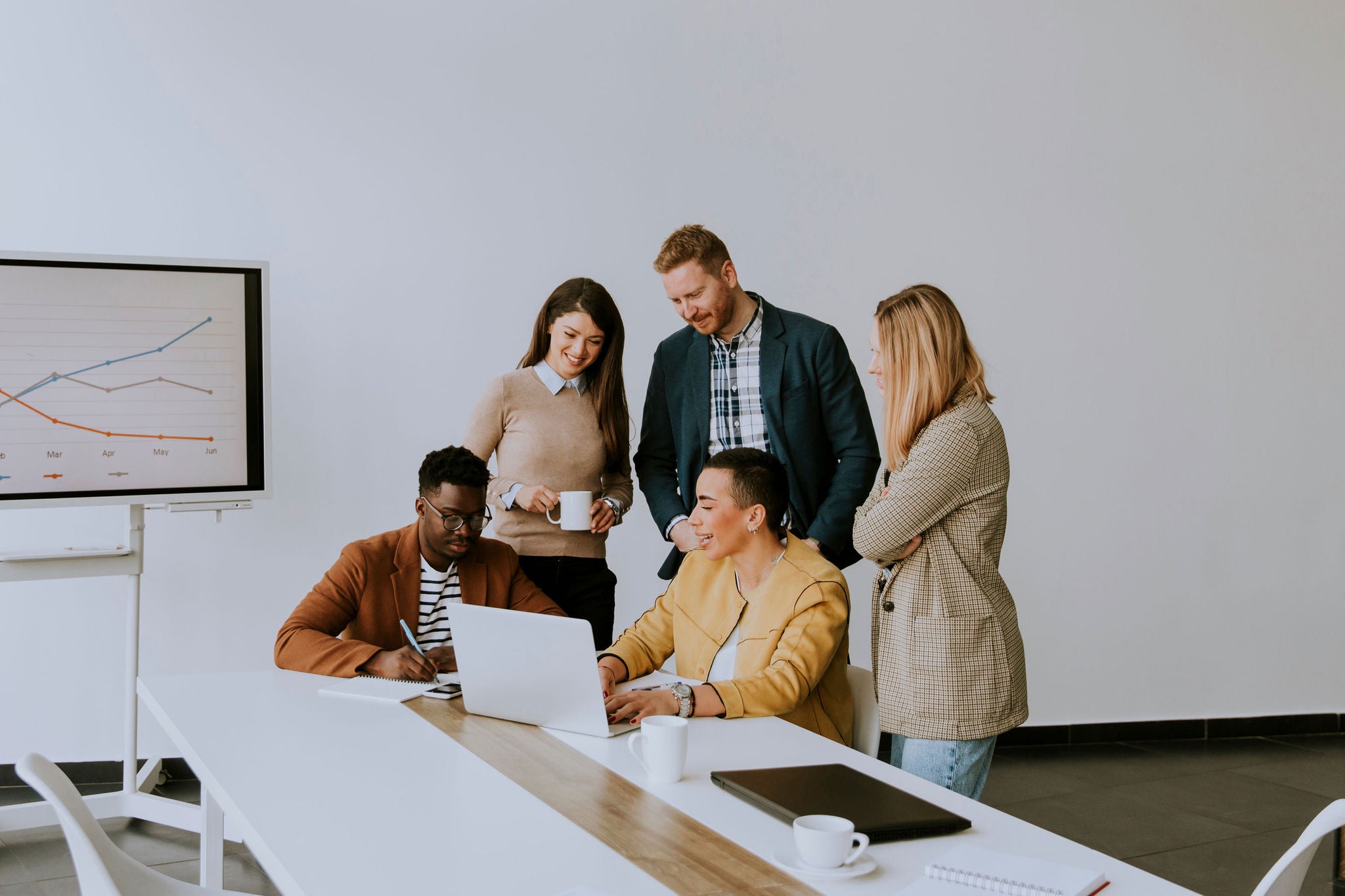 Group of young multiethnic business people working together and preparing new project on a meeting in the office