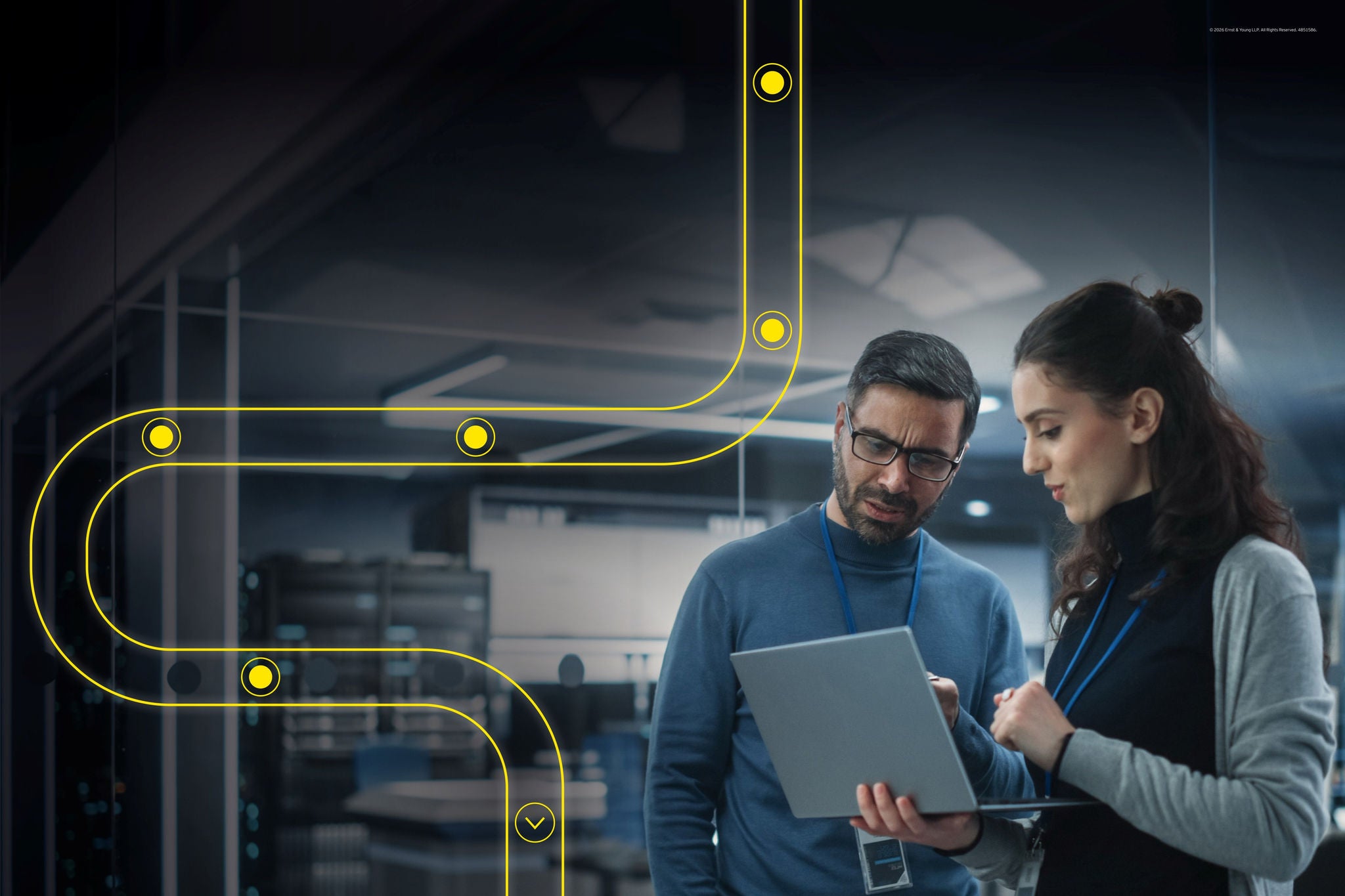 Professionals reviewing AI strategy on a laptop in a modern tech workspace