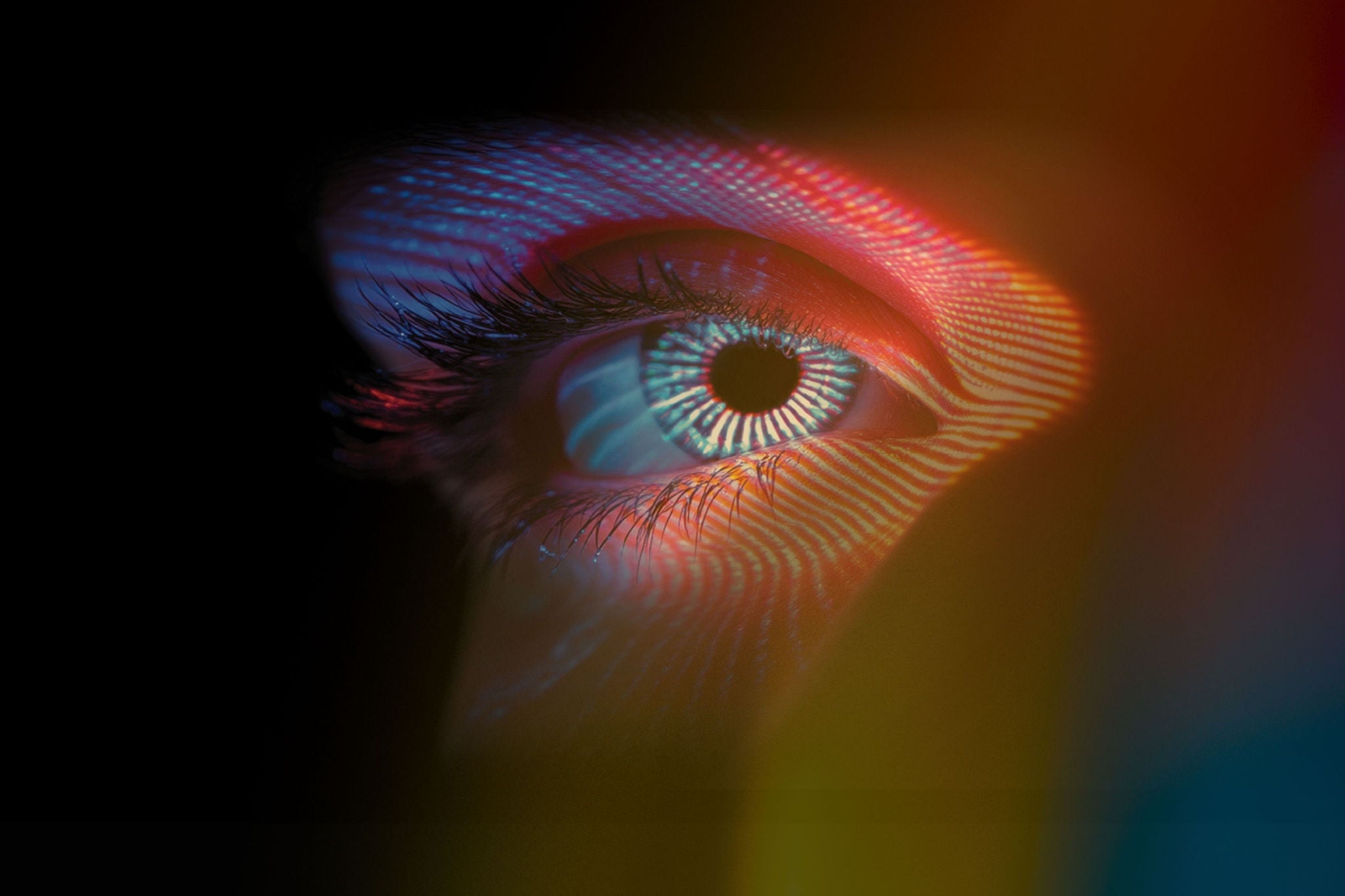 Close-up of an eye looking at digital data