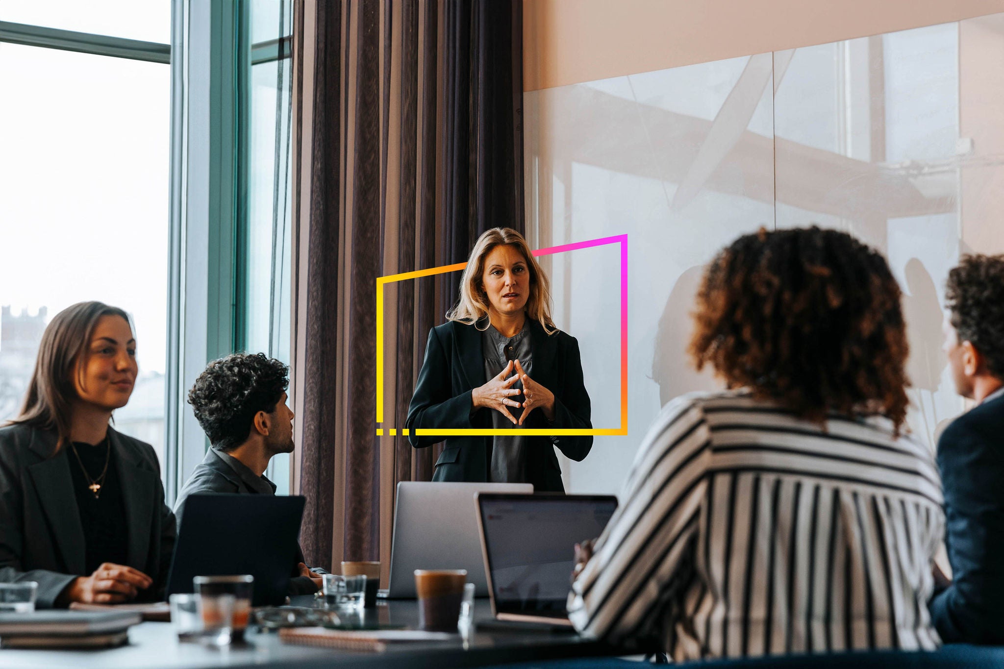 Planning business strategies with colleagues in board room