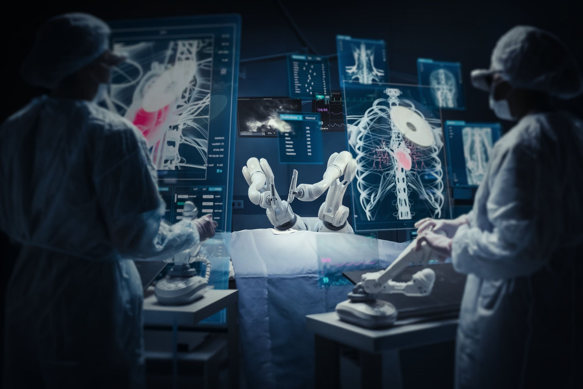 Surgeon Wearing AR Headsets And Using High-Precision Remote Controlled Robot Arms To Operate On Patient In Hospital. Doctor Controlling Robotic Limbs, Observing Organs On Holographic VFX Displays.