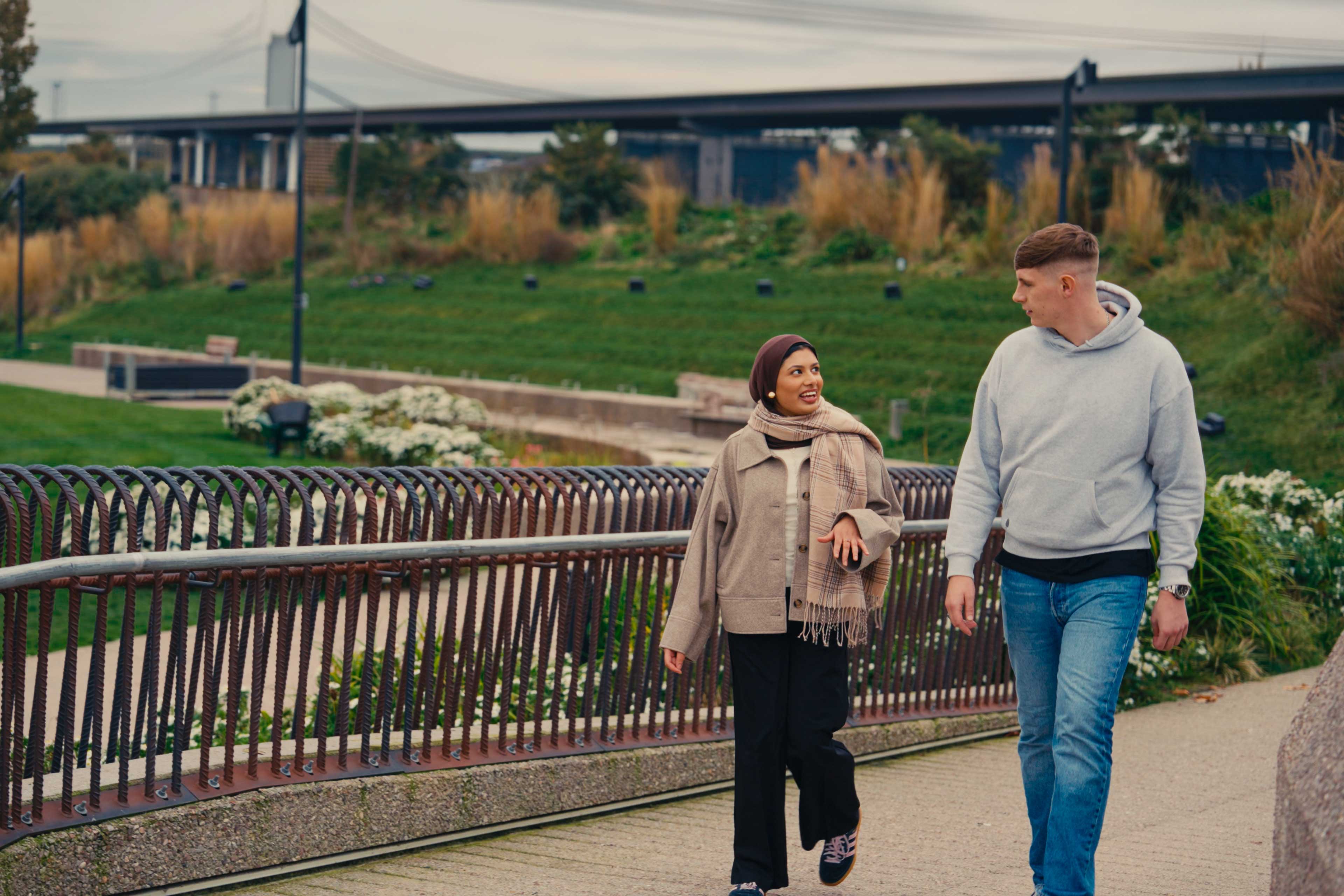 Two people walking in the park