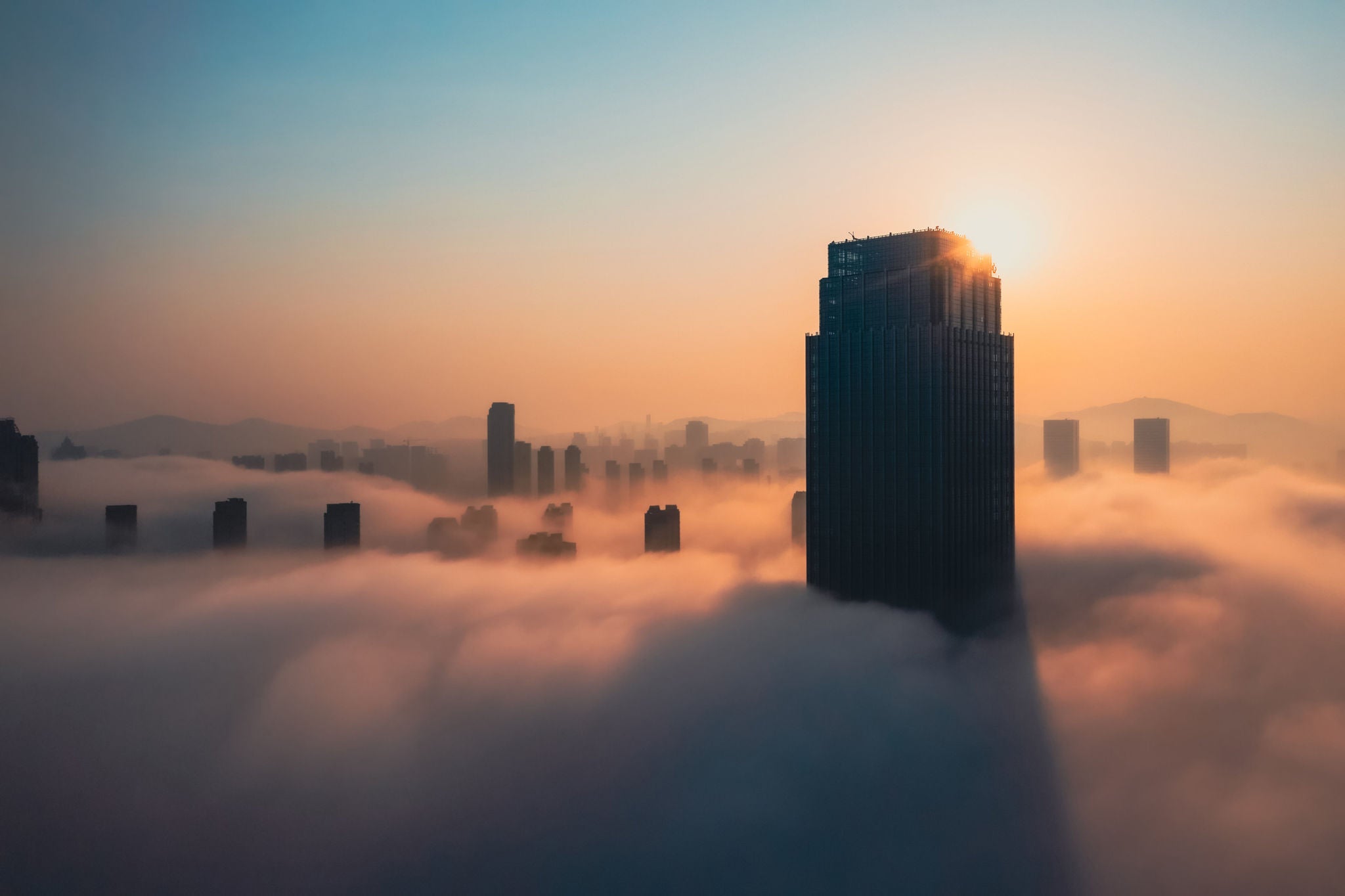 Aerial view of skyscrapers in the clouds