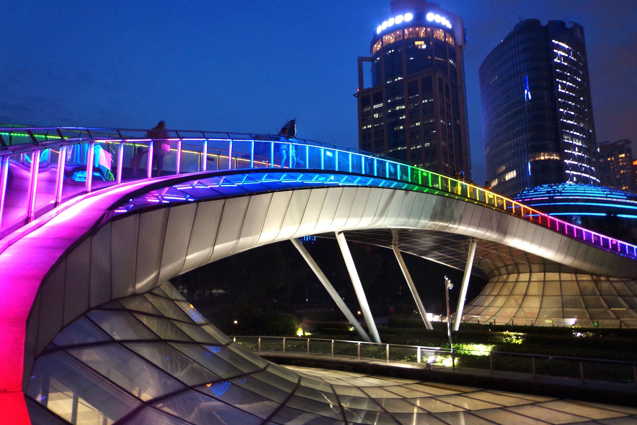 Rainbow-colored arch bridge in Shanghai at dusk - Shanghai, China                 