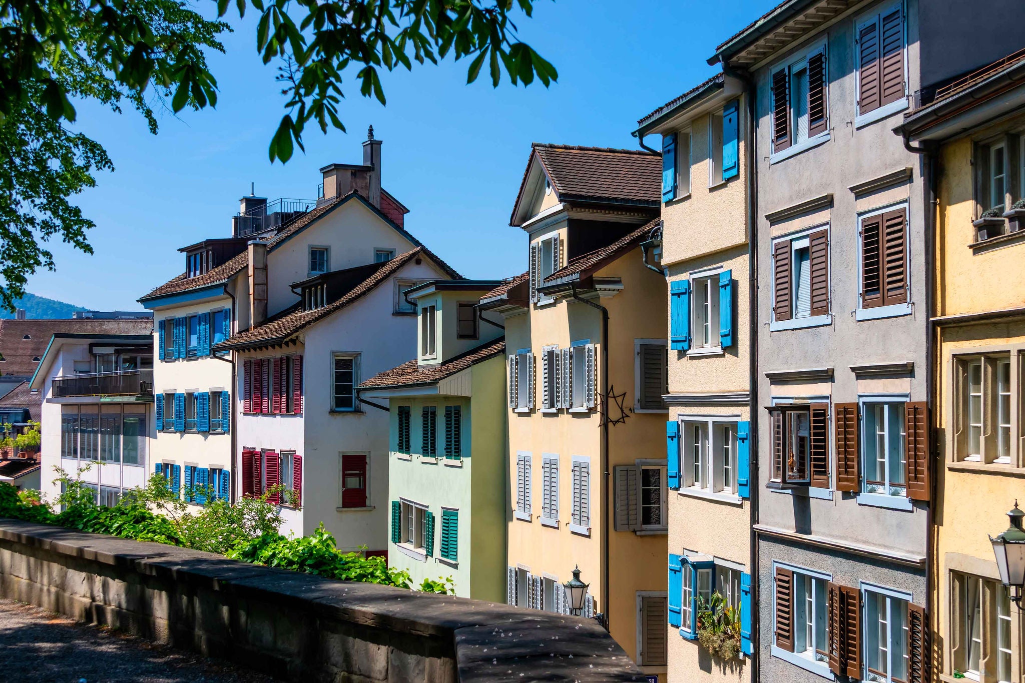 Historic colorful buildings lining Lindenhof hill in Zurich