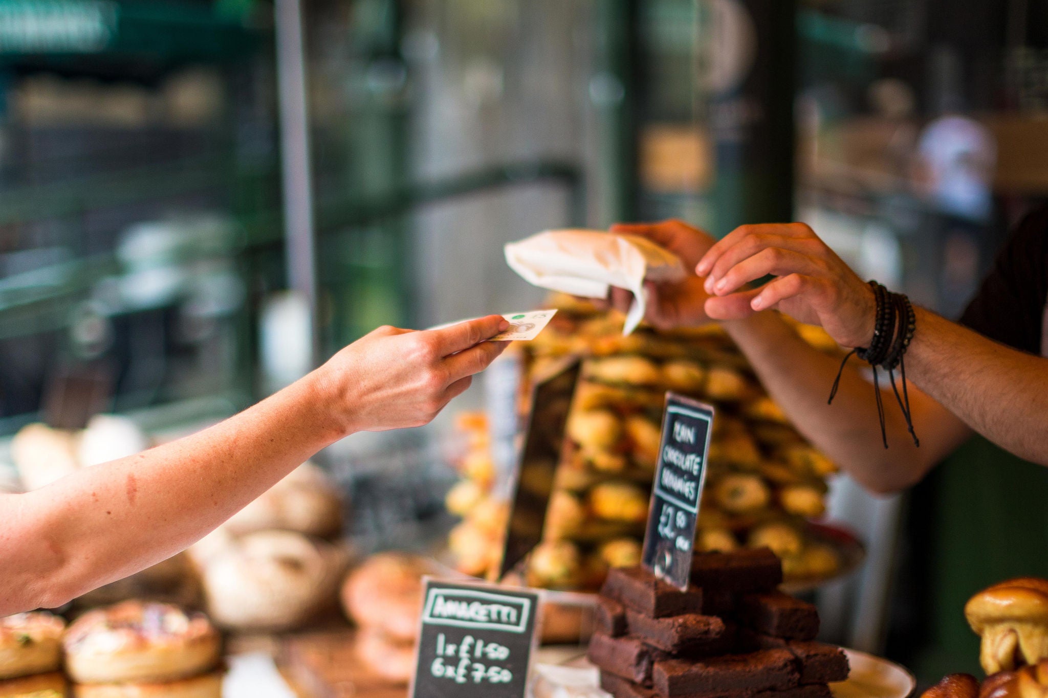 Hands exchanging item in purchase