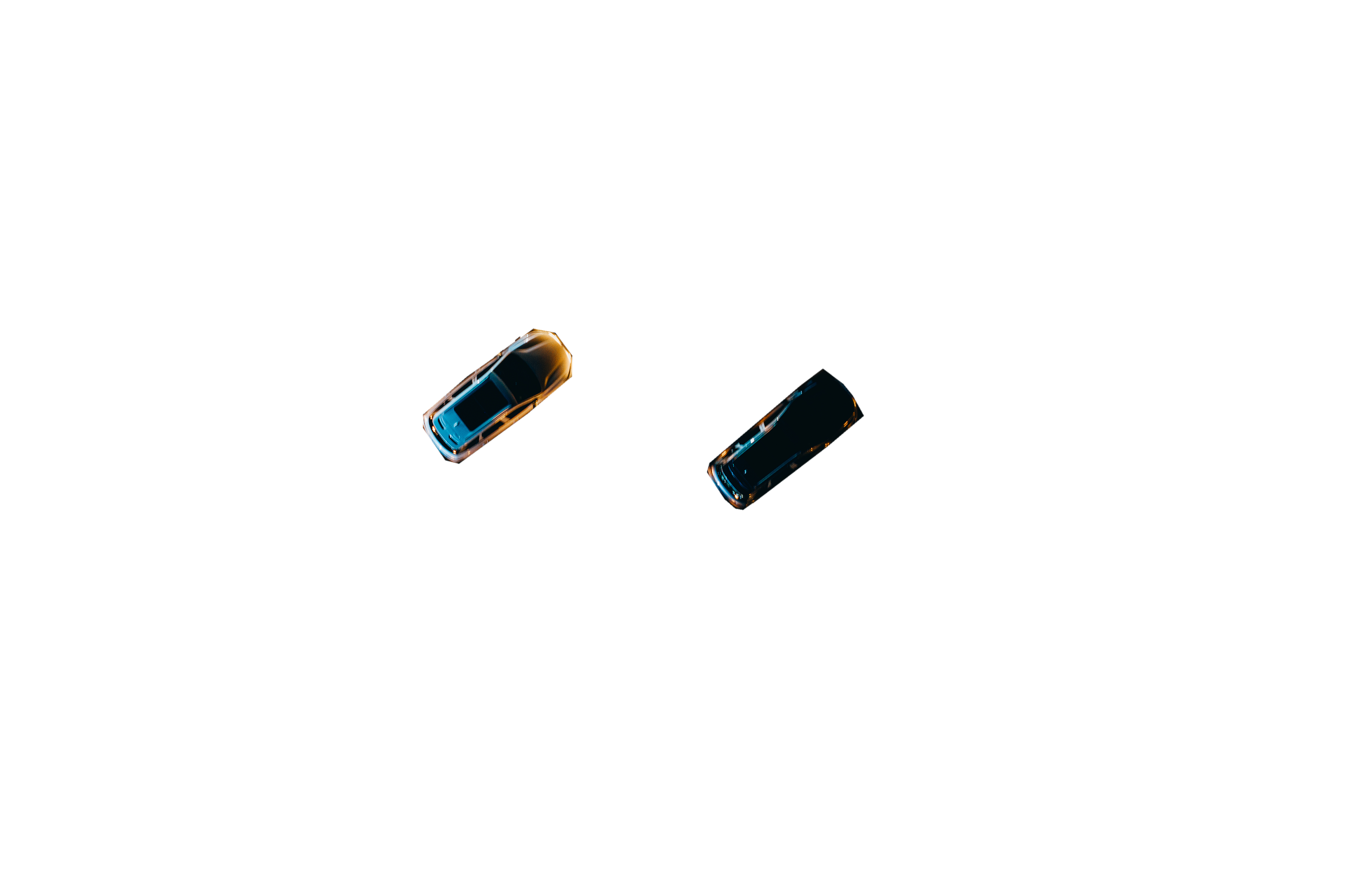 Aerial view of cars undergoing various technical tests at night.