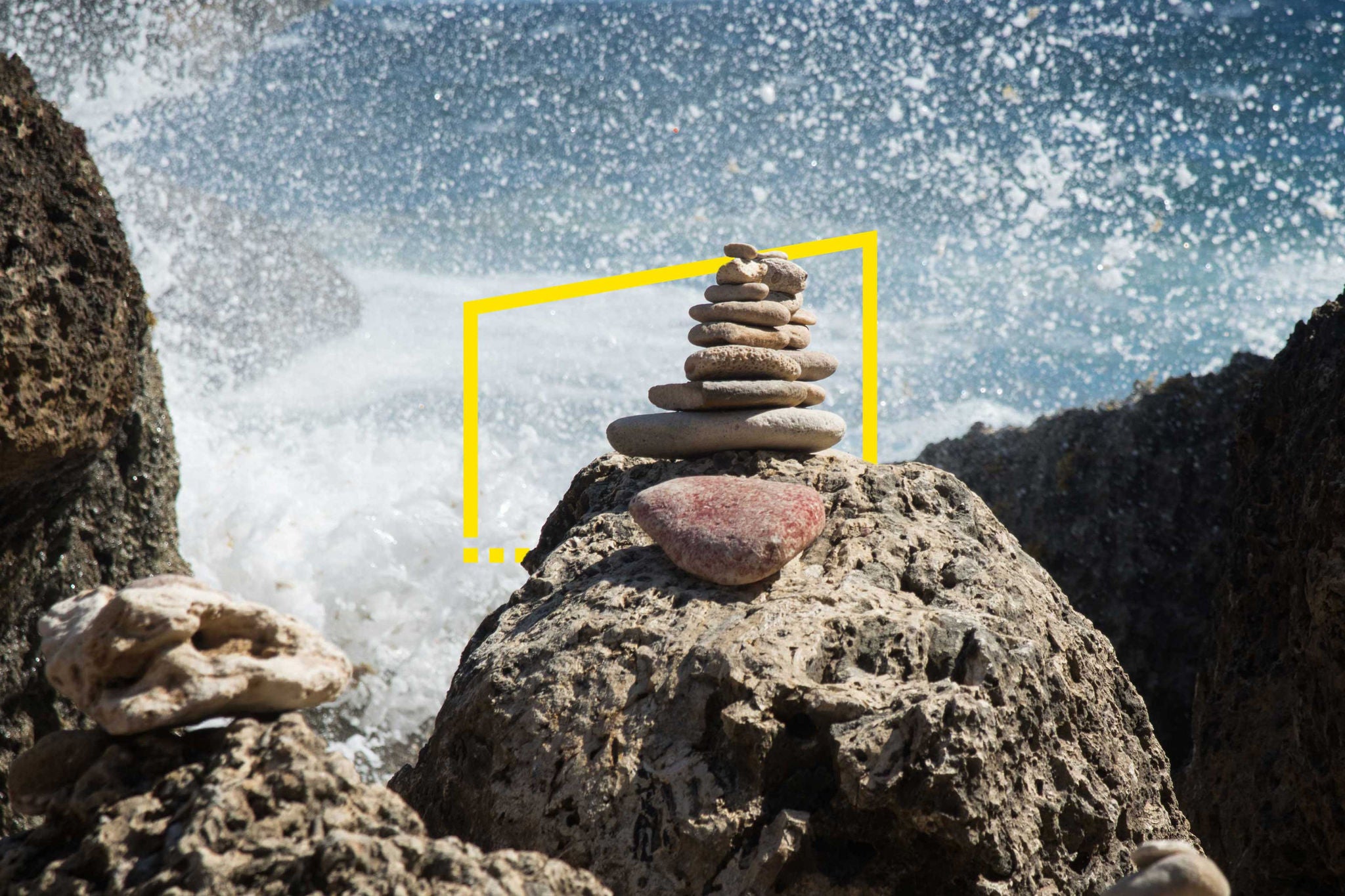 EY - Stone-stack-on-large-ocean-rocks-among-the-waves