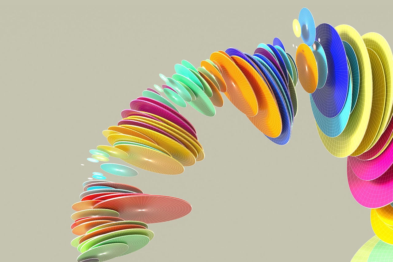 Digital generated image of multi colored discs organised into circular pattern.