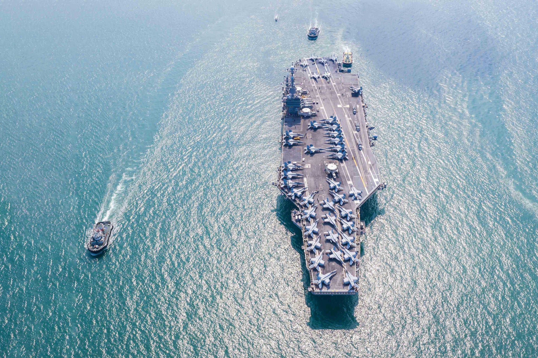 Navy Nuclear Aircraft carrier, Military navy ship carrier full loading fighter jet aircraft, Aerial view.
