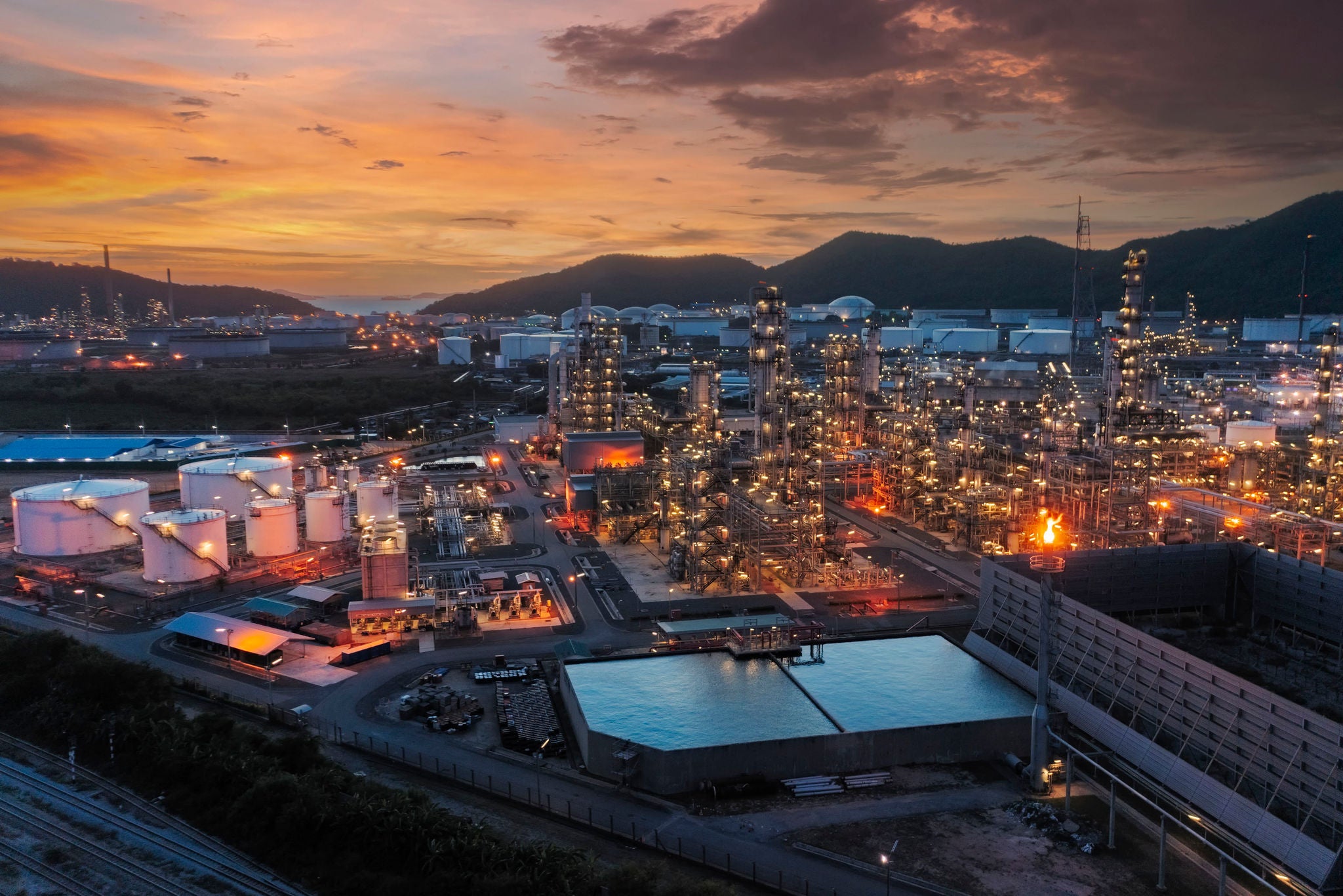 Aerial view Oil refinery at dusk for oil or gas industry, Energy or Oil Industrial concept background.