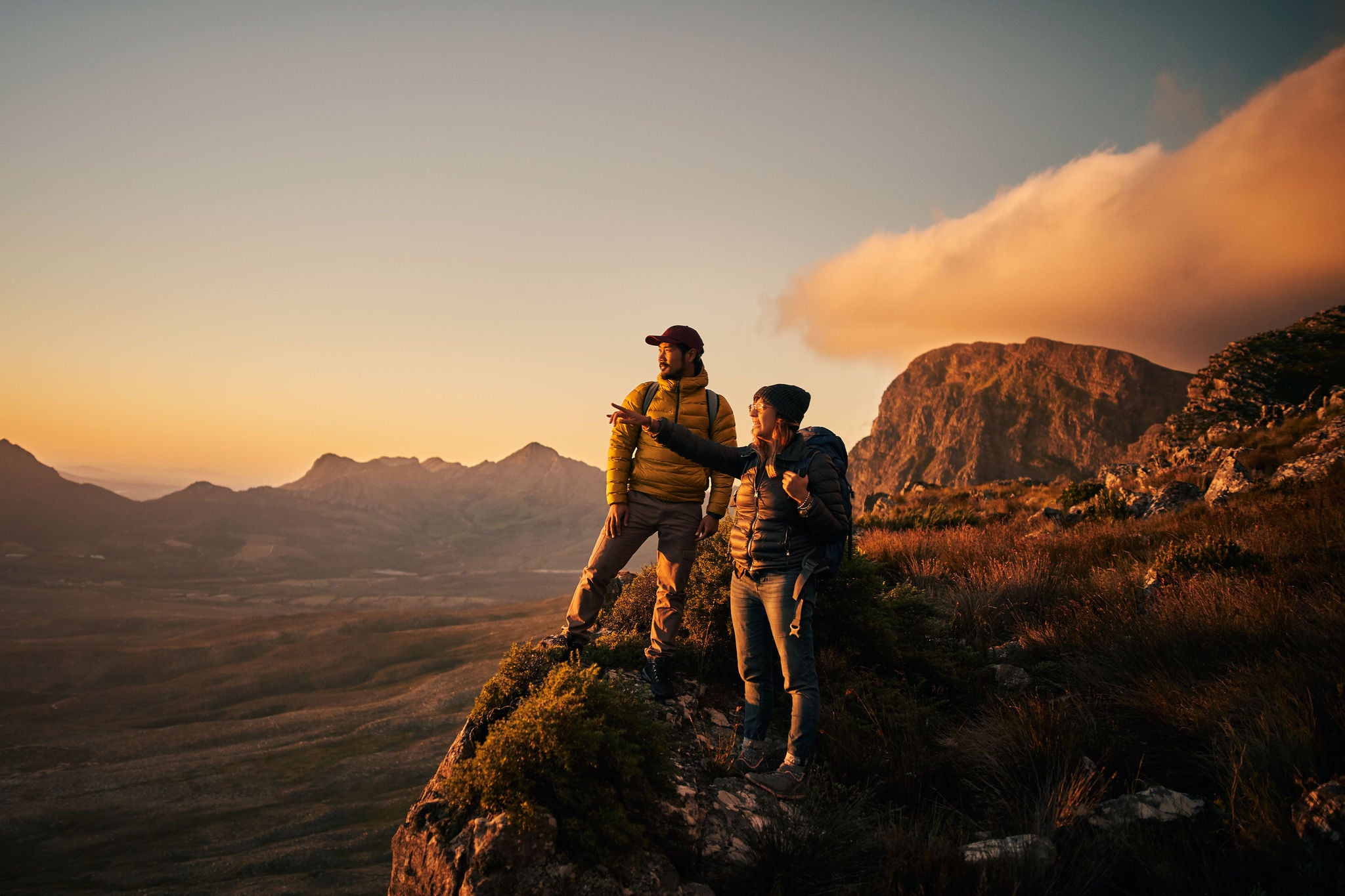 Shot of a young couple out mountain climbing together