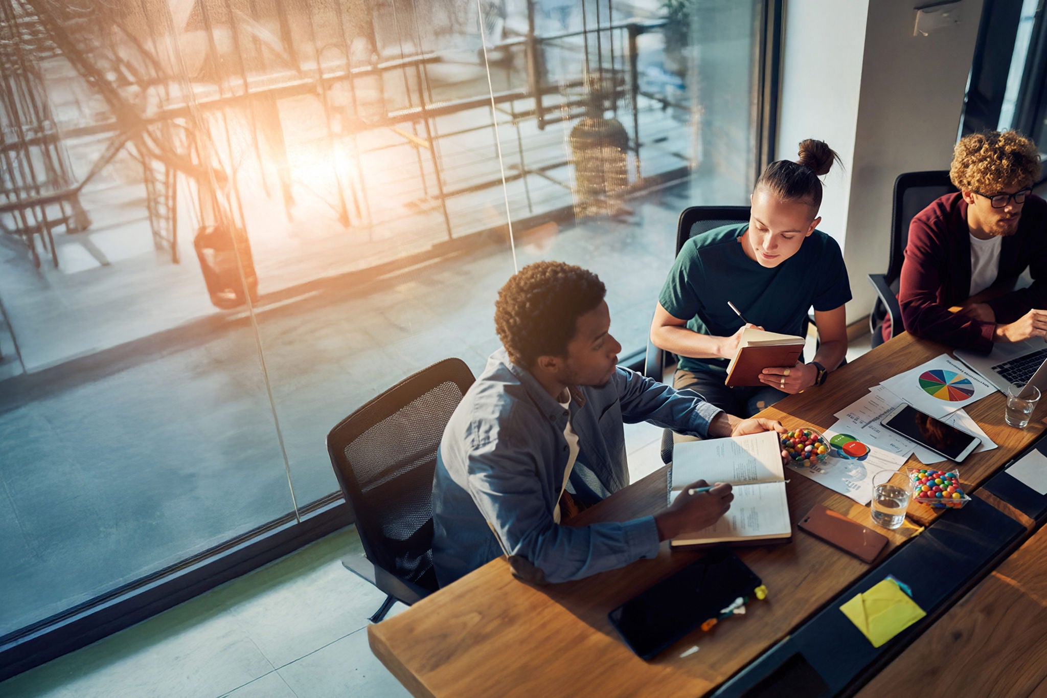 Colleagues meeting in the office discussing the budget 