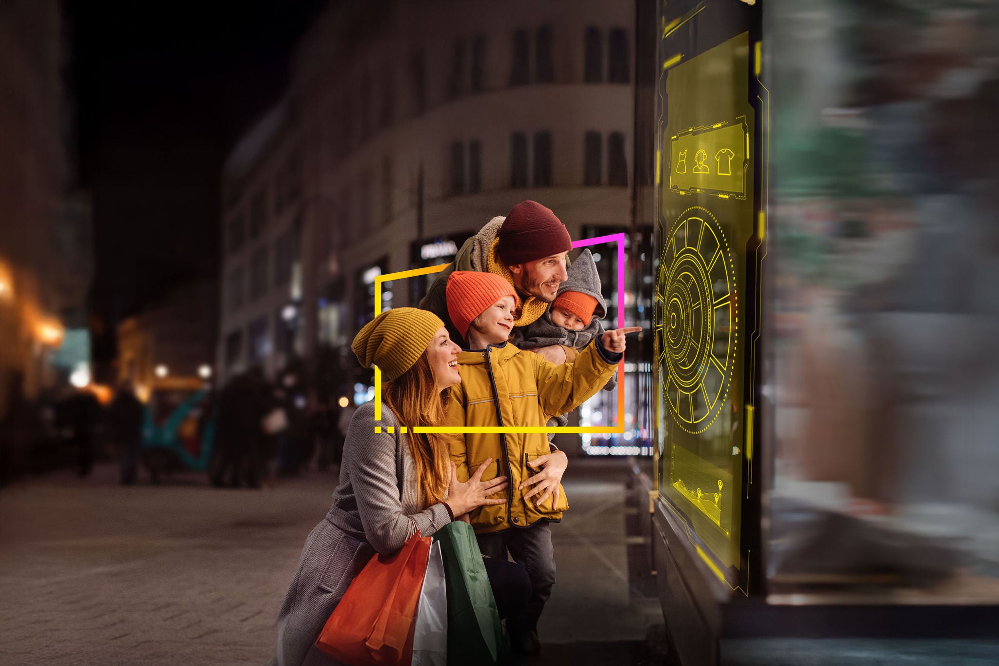 Family with two kids in front of the store window in a big city at night