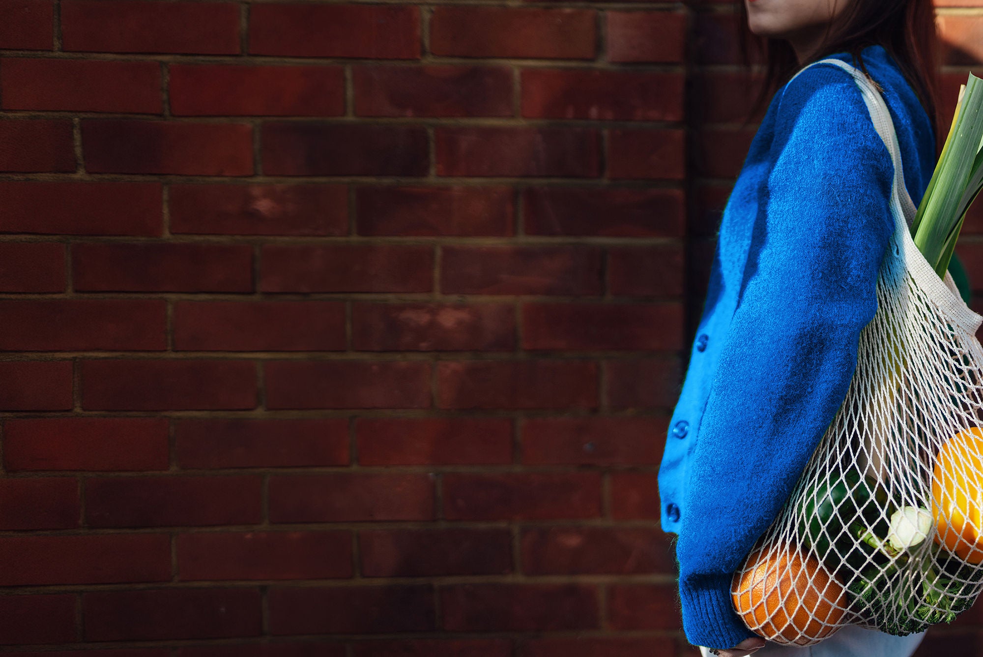 image of a person holding a knit grocery tote bag - eyp study