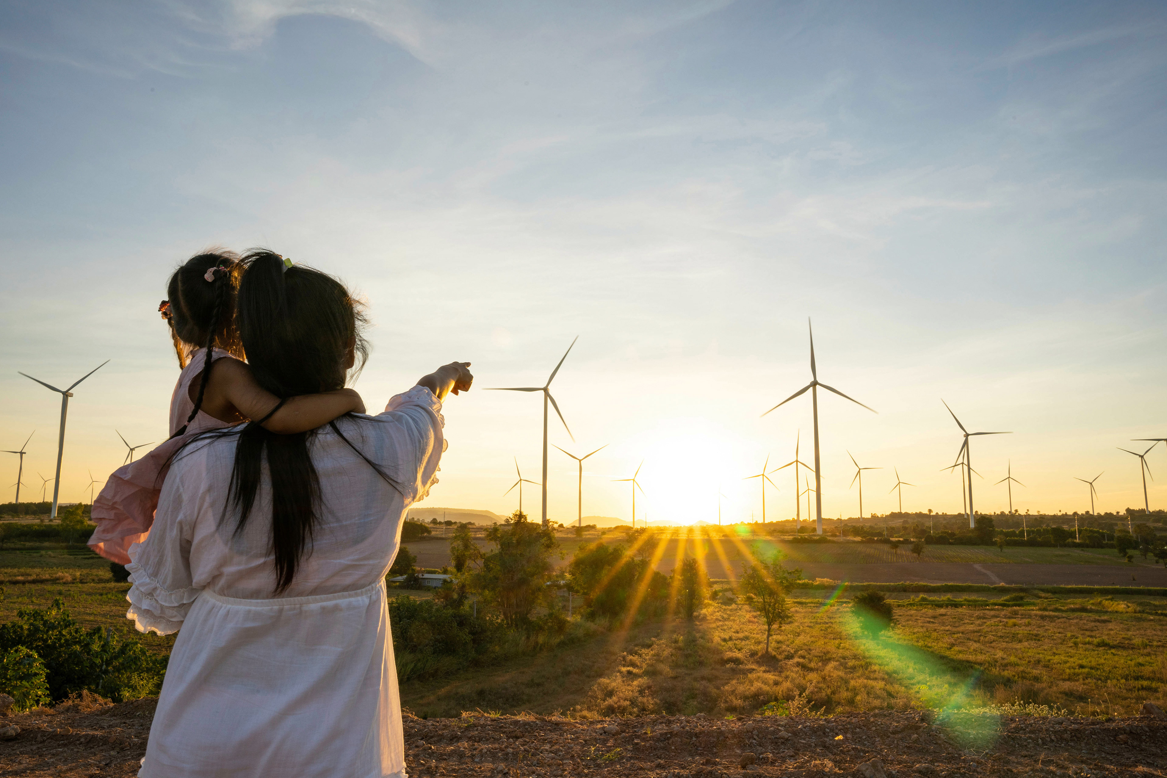 Soccer players plan the game strategy with team using a drawing on the ground.
