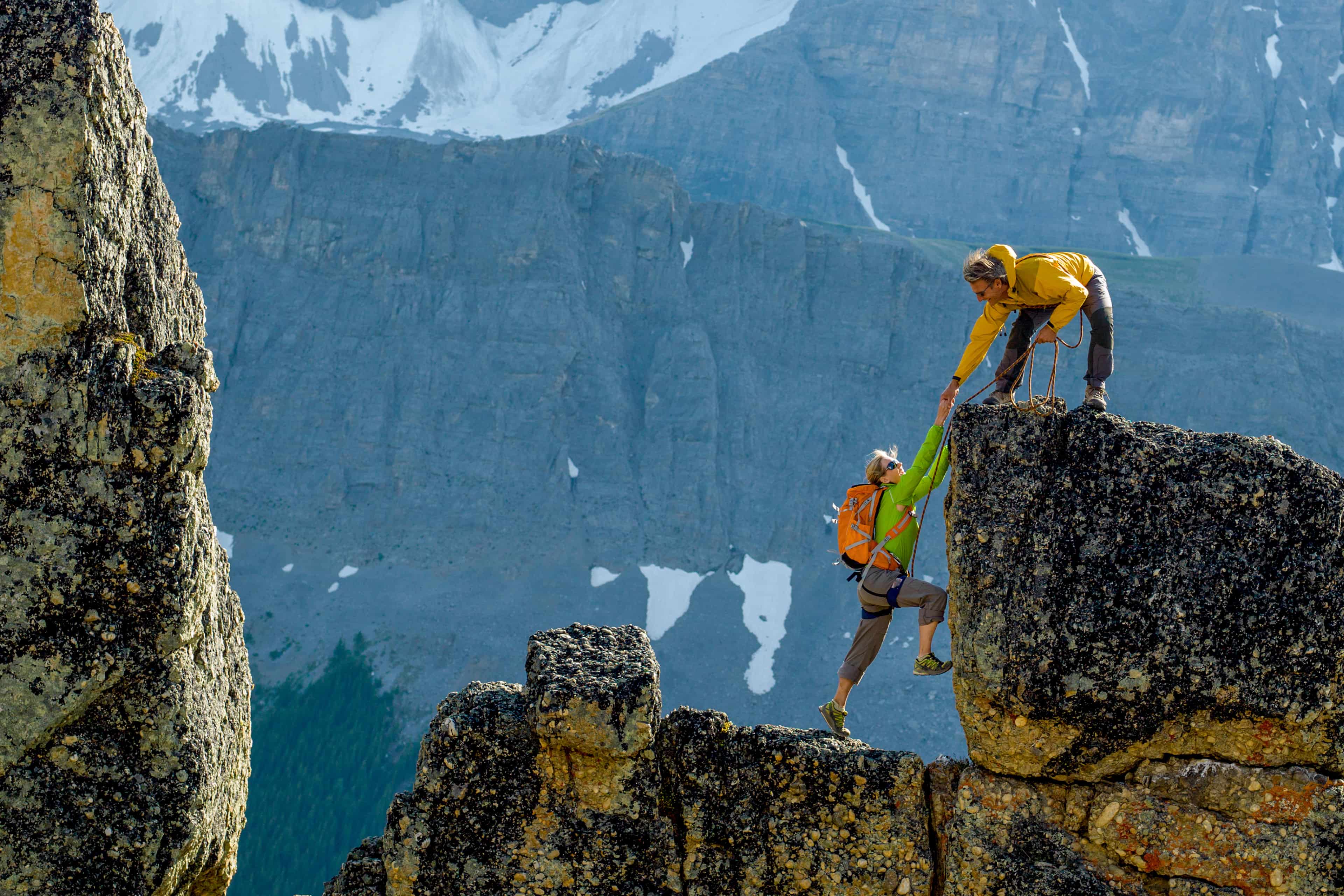 two people climbing mountain