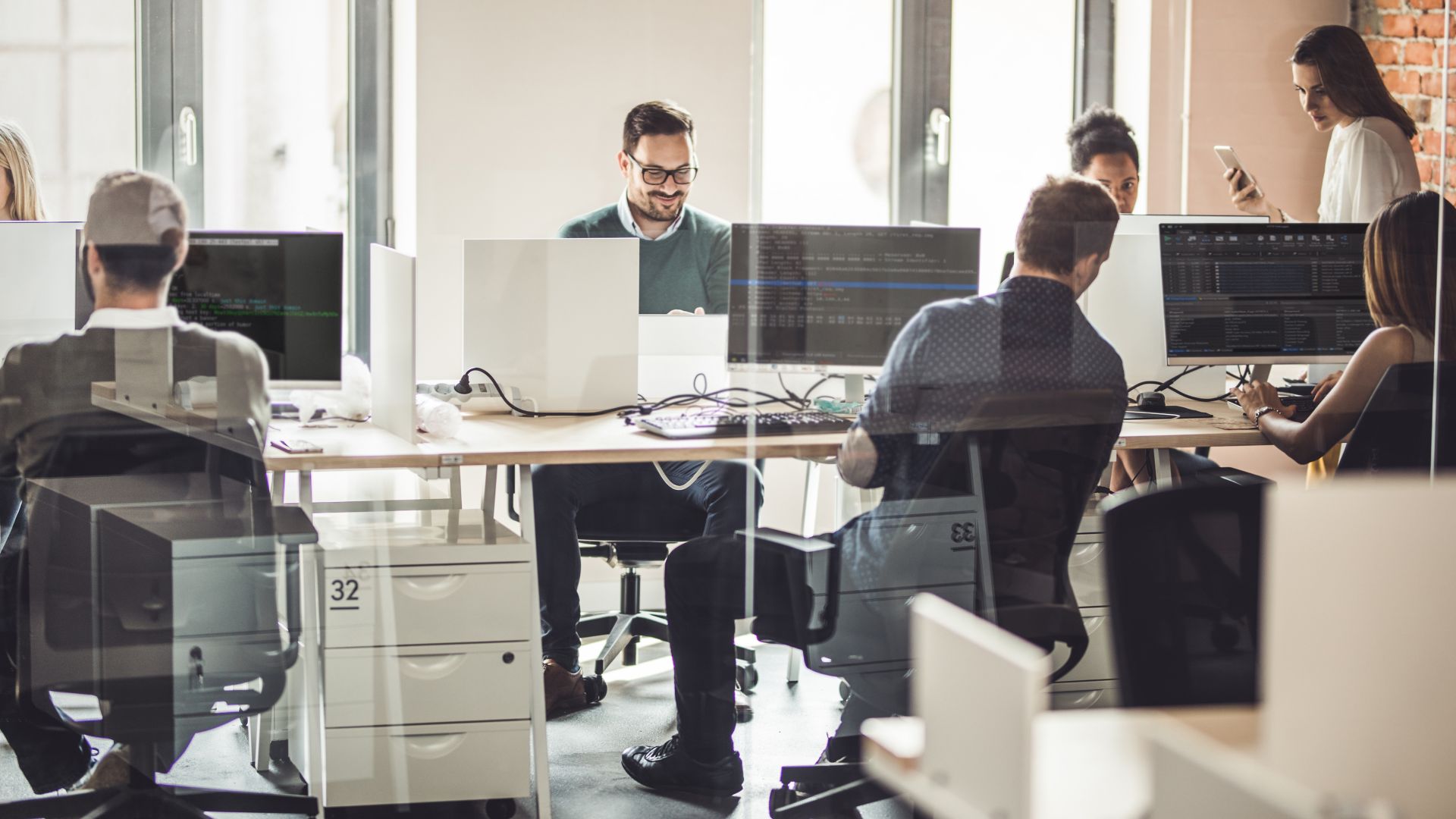 a group of programmers in an office