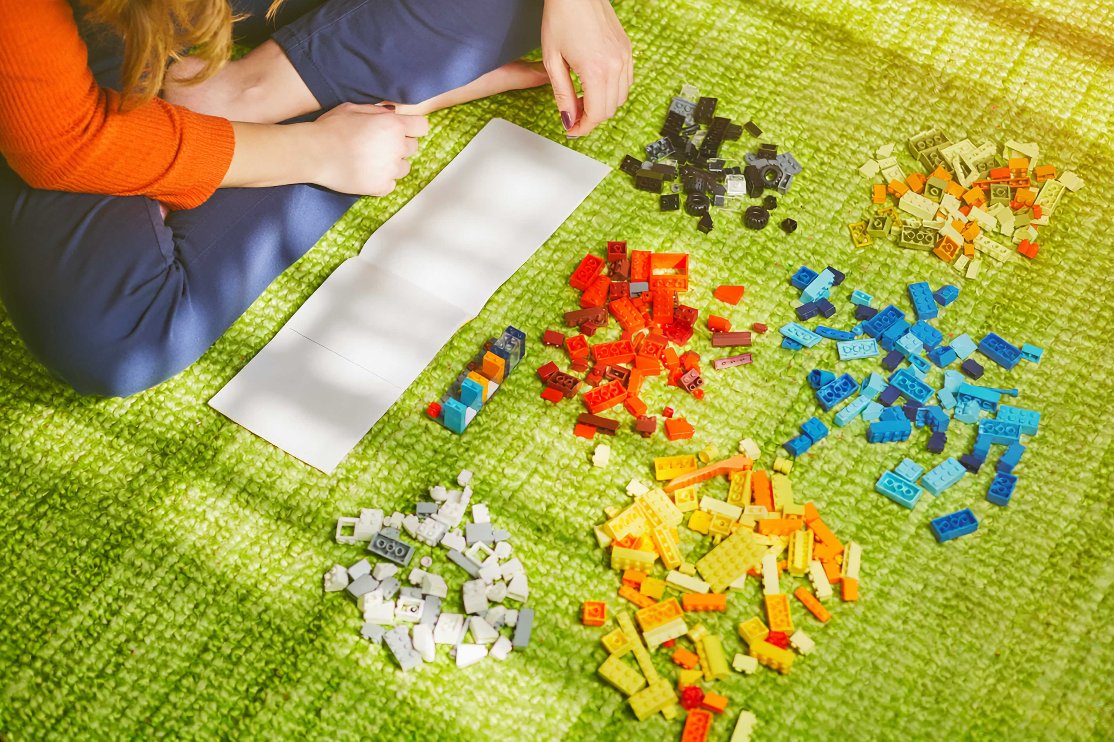 Lady building a lego
