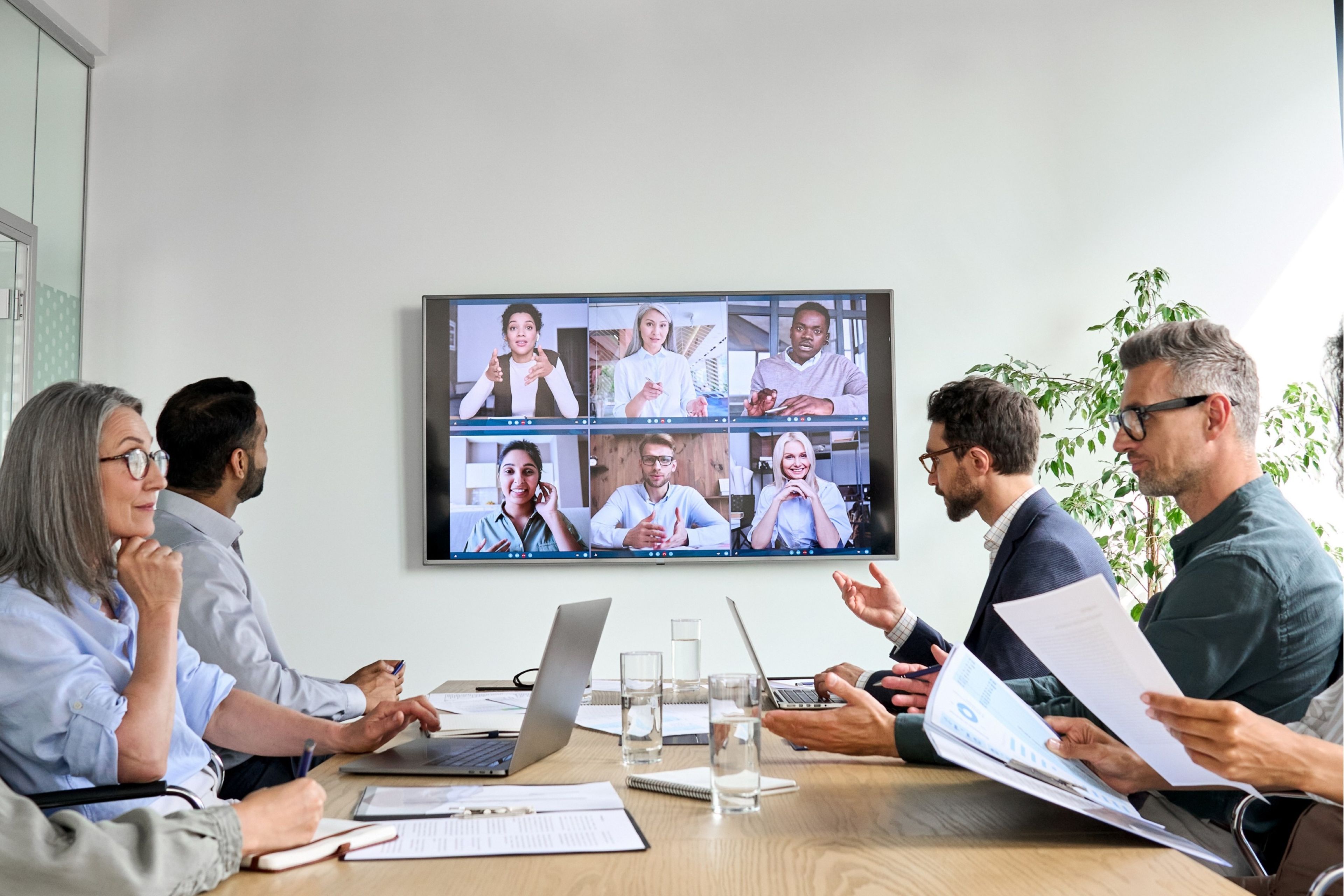 Team collaborating in a hybrid video conference meeting