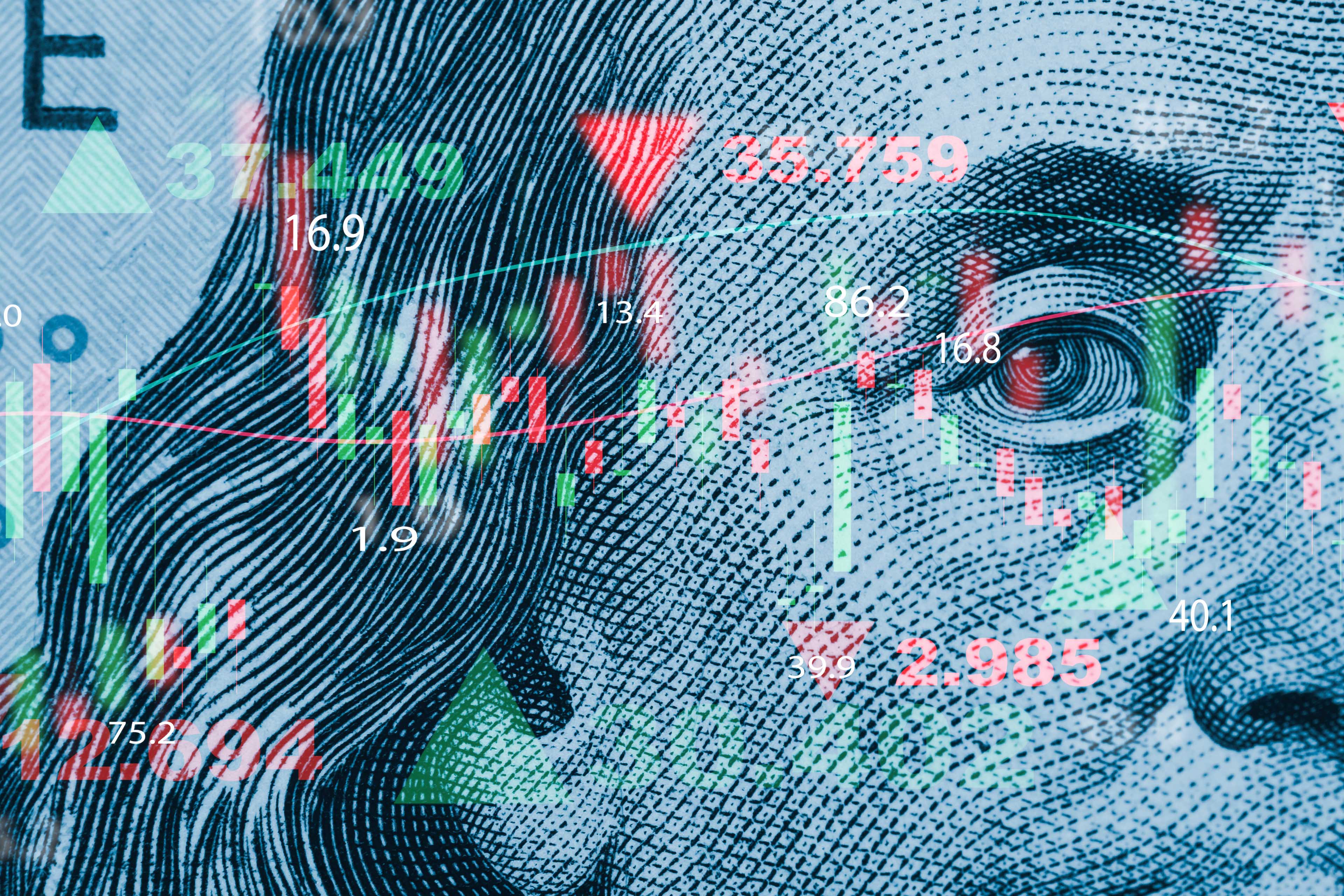 Benjamin Franklin face on USD banknote with stock market chart graph