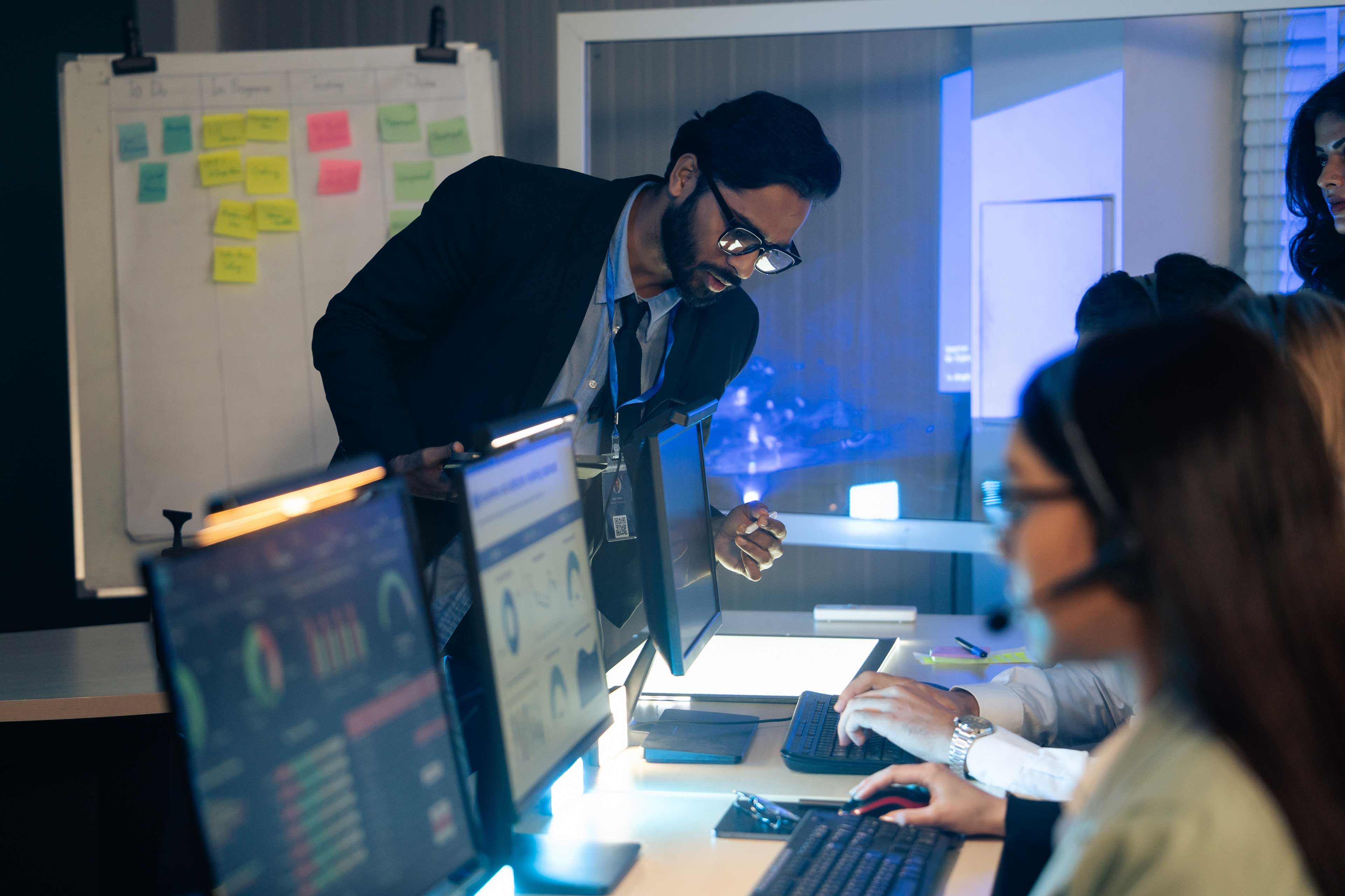 Manager, reviews data and reports on a computer screen