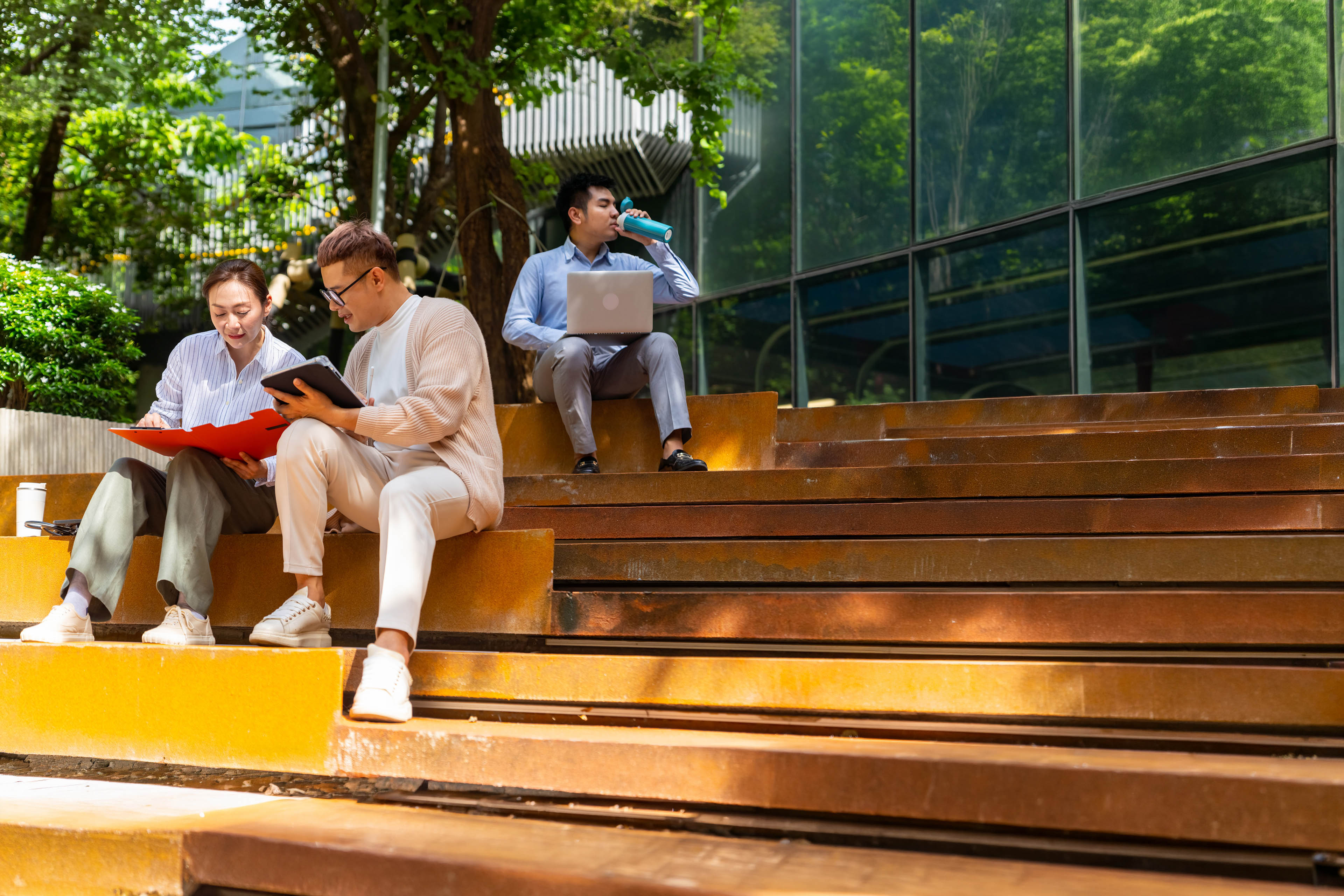 A Group of businesspeople working together in a public park