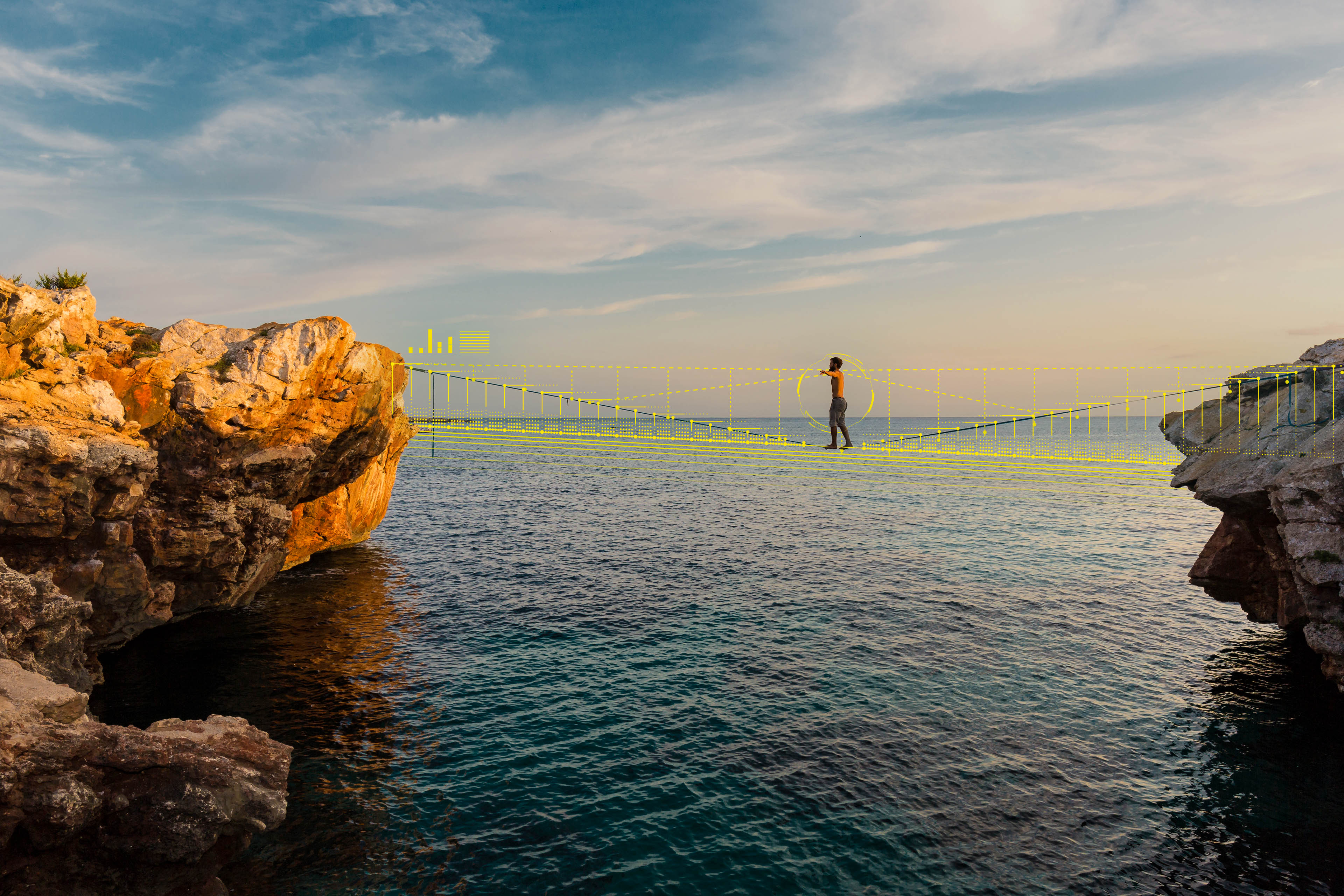 Man practicing slackline over the sea
