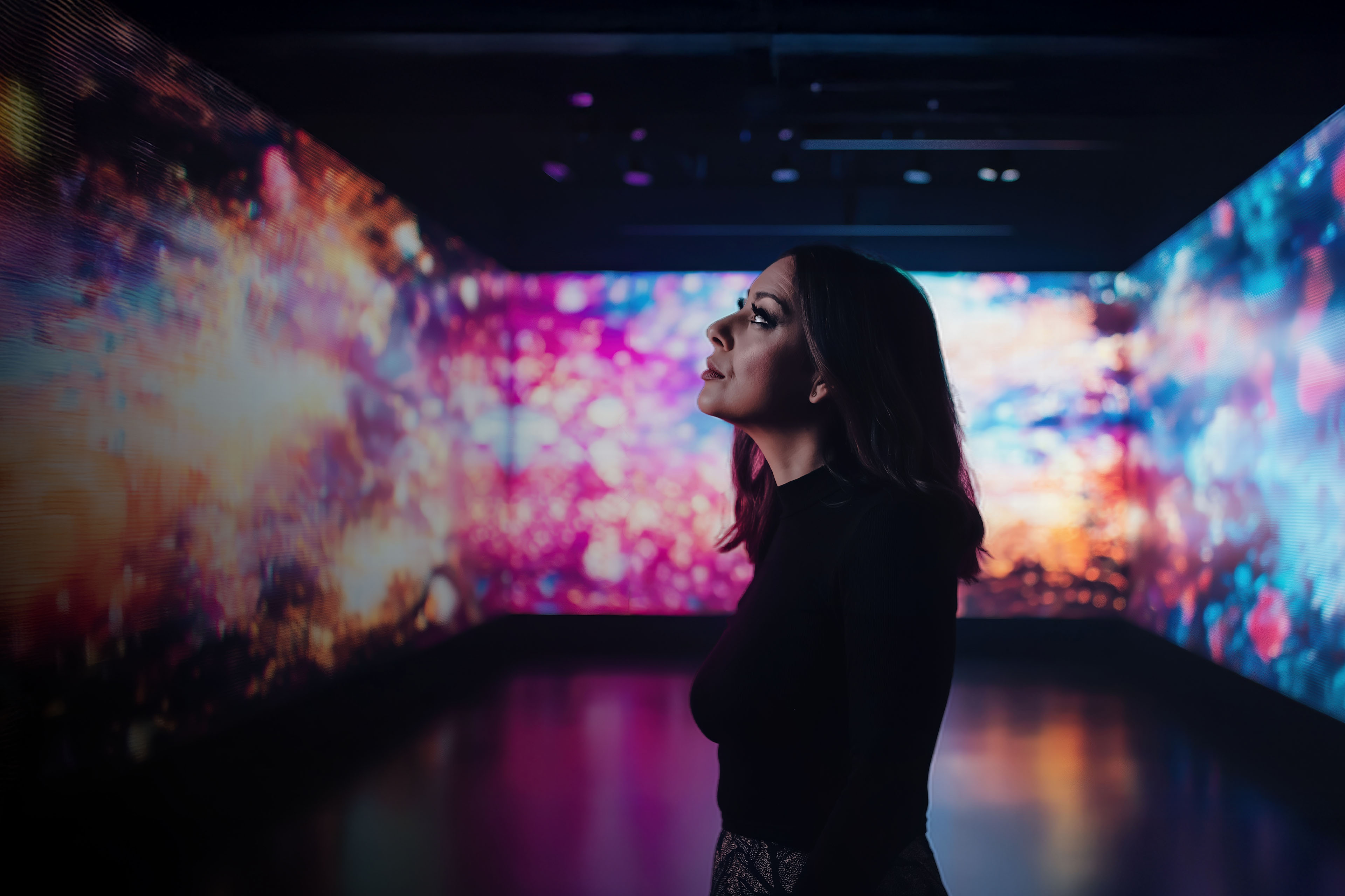Person in gallery enjoying the digital art installation