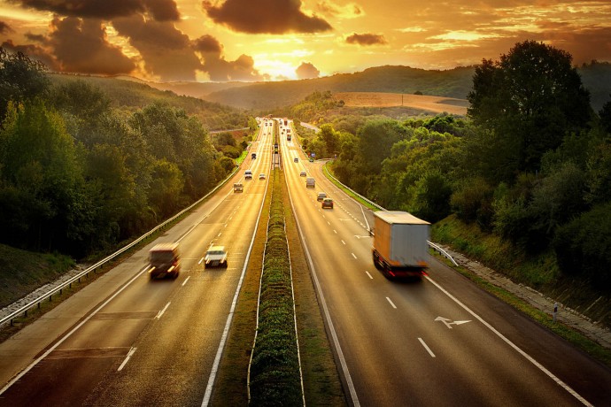 highway trafic in sunset background