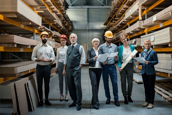  Family business owners standing in their factory metadata image