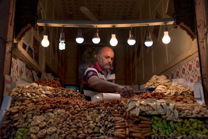 Man working at open market food stall