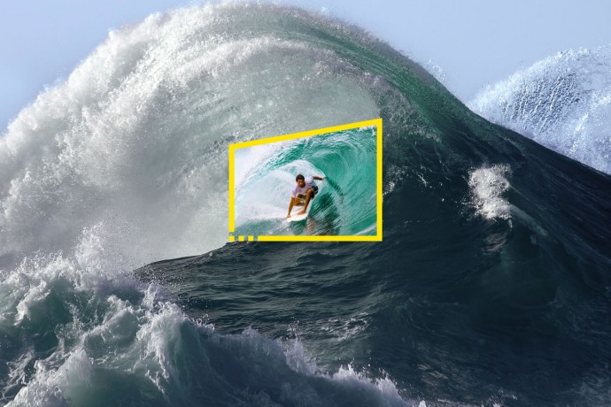 Surfer in tube of giant wave