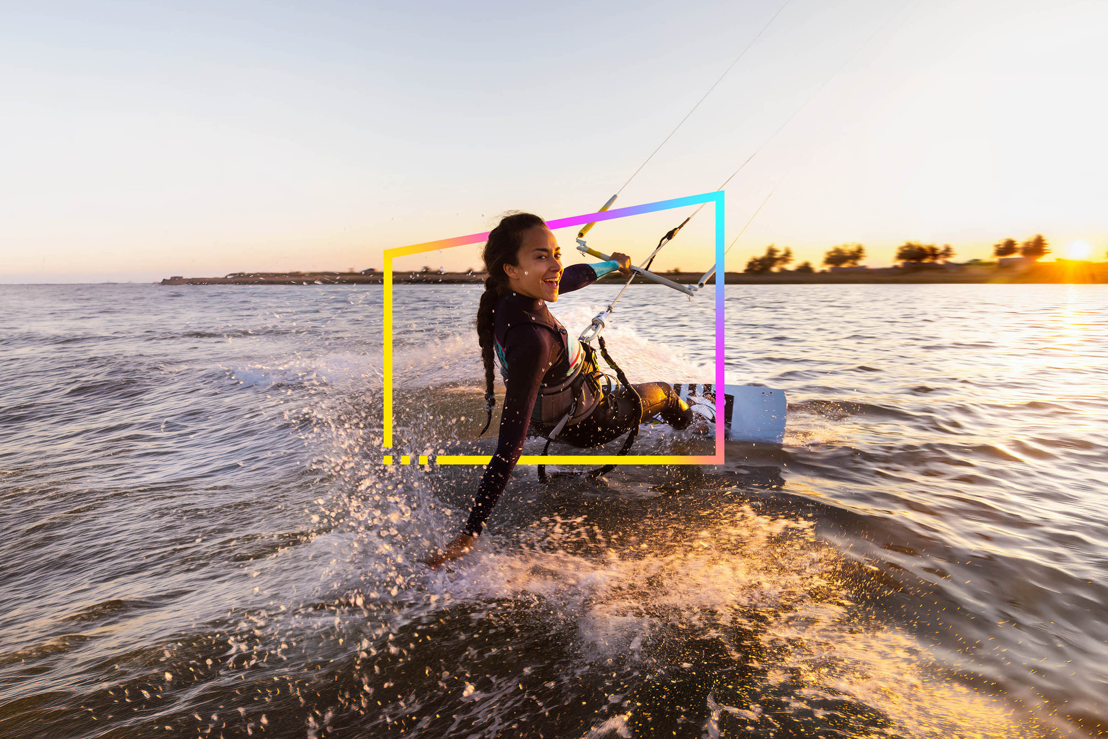 Young woman enjoying her kitesurfing success