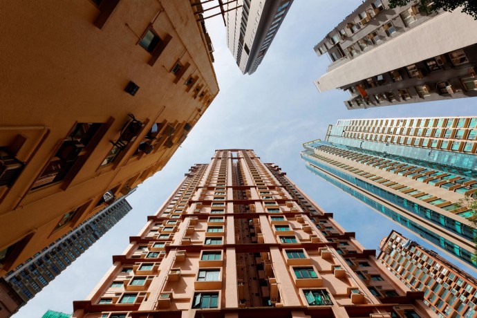 Low angle view of high-rise residential towers in Hong Kong