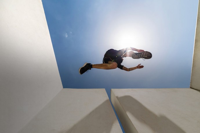 Man jumping in the city during a parkour session